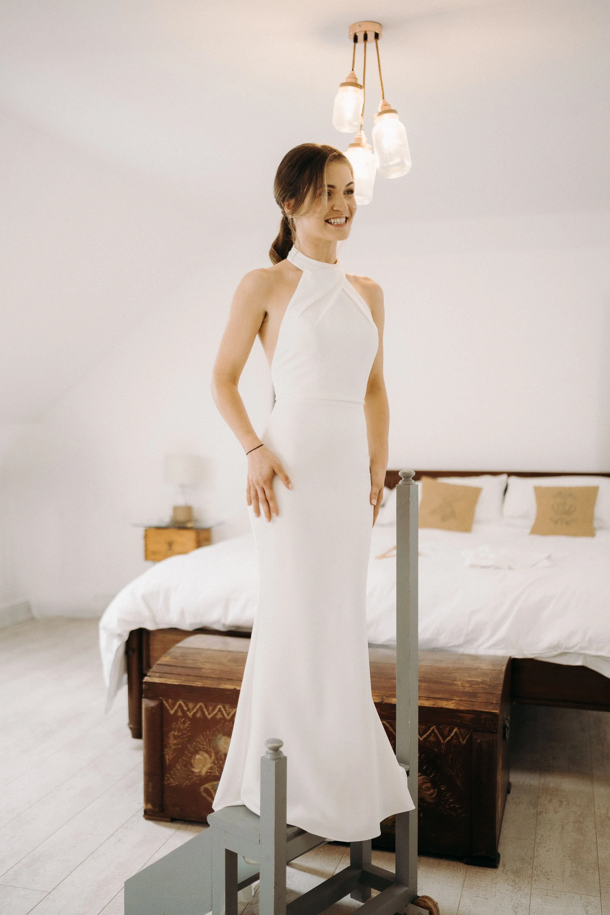 Bride looking excited just after putting on her Made With Love Bridal wedding dress in the bridal suite at Two Woods Estate.