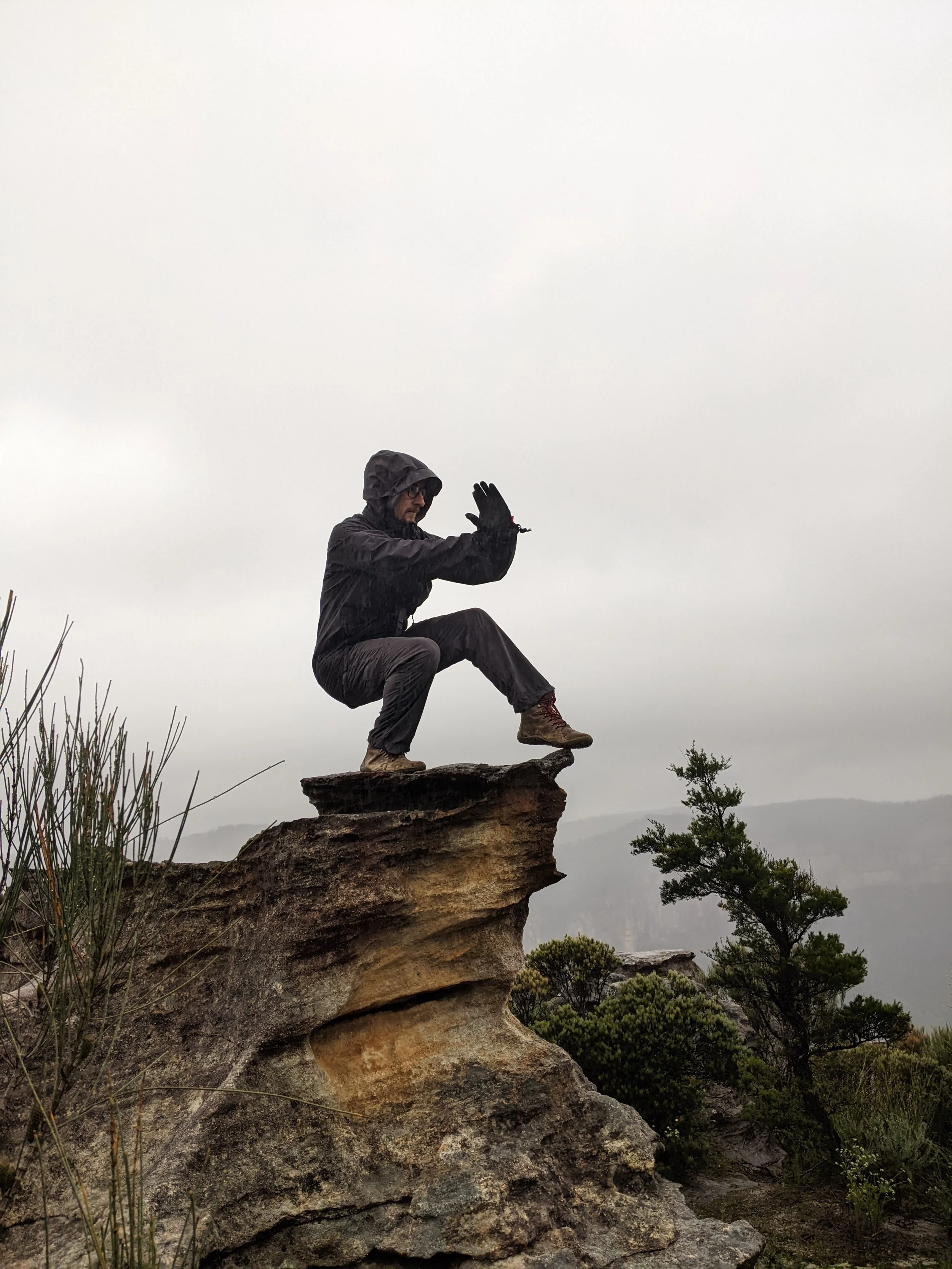 Damien holding xu bu on top of a mountain in New South Wales