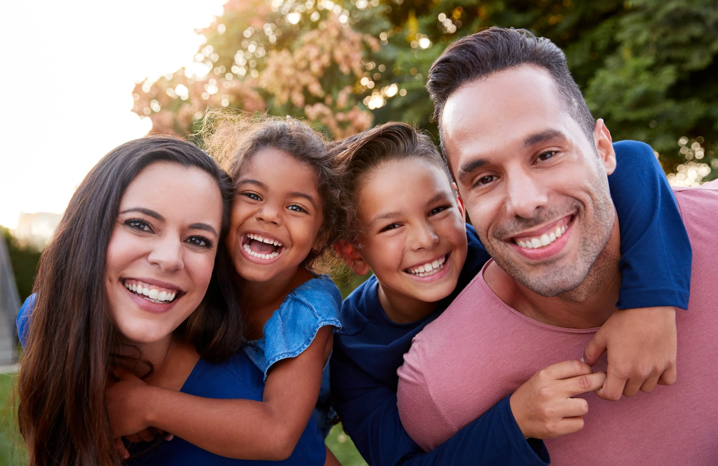 Image of young family smiling and happy