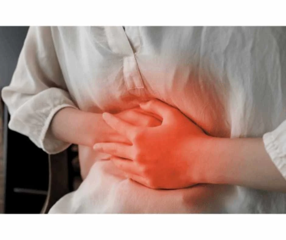 Person experiencing chest and upper abdominal discomfort associated with acid reflux and heartburn symptoms