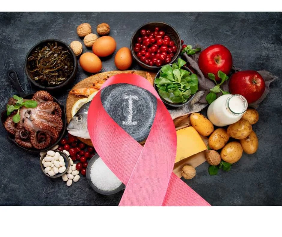 Iodine-rich foods arranged around a pink breast cancer awareness ribbon, illustrating the role of iodine in breast health and hormonal balance