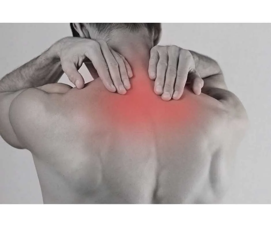 Person holding upper back and neck with highlighted red inflammation, representing muscle tension and chronic pain.