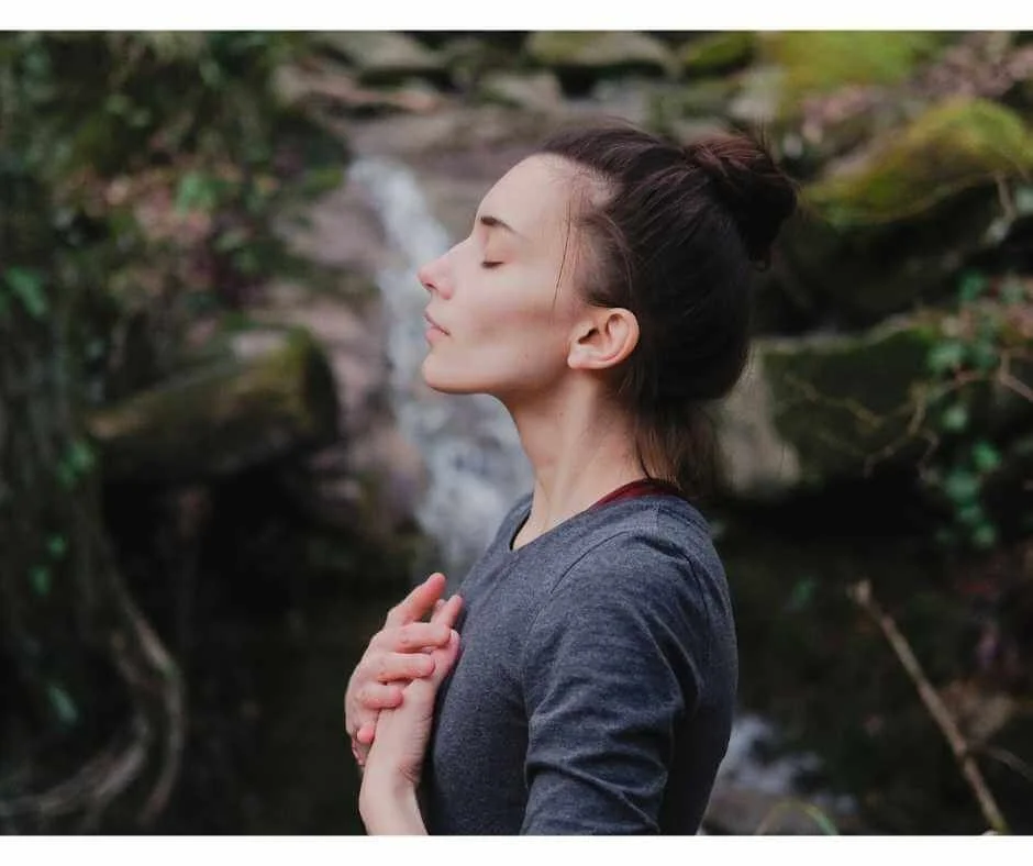 Woman practicing calm nasal breathing to support oral health and whole-body regulation