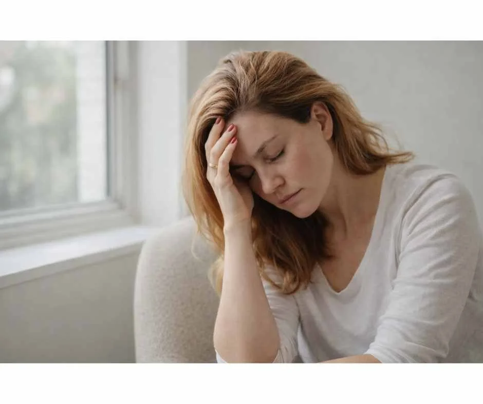 Woman experiencing low energy and fatigue, illustrating the effects of chronic stress on adrenal and thyroid hormone regulation