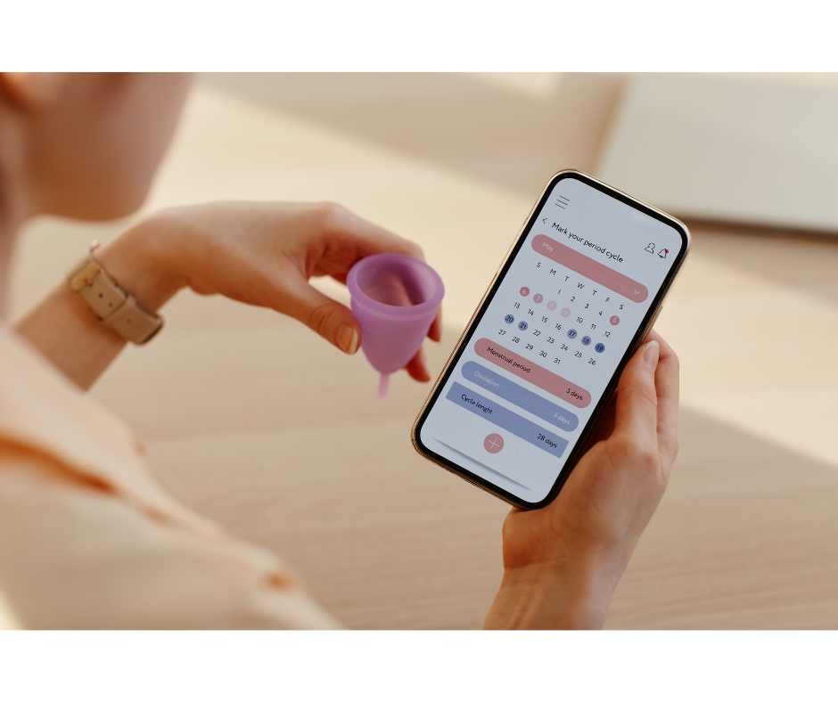 Woman using a menstrual cycle tracking app as a non-hormonal birth control method