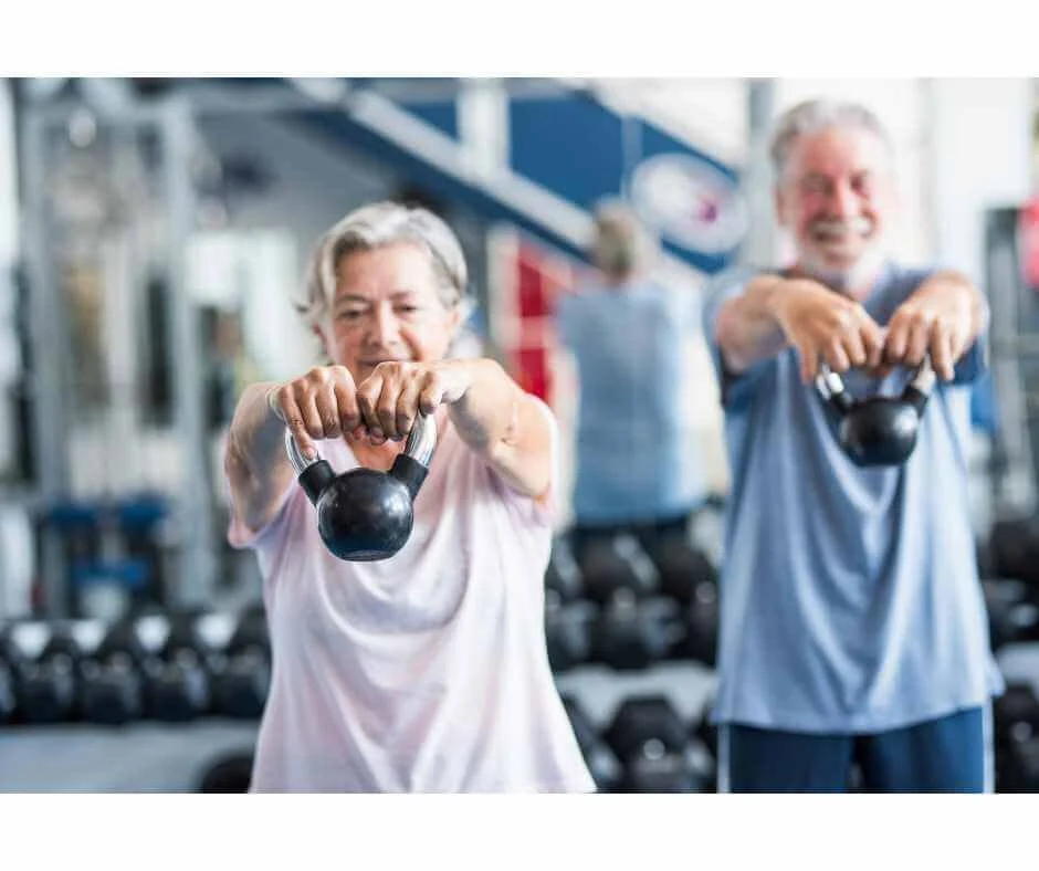 Postmenopausal women performing strength training exercises to support bone density and prevent osteoporosis