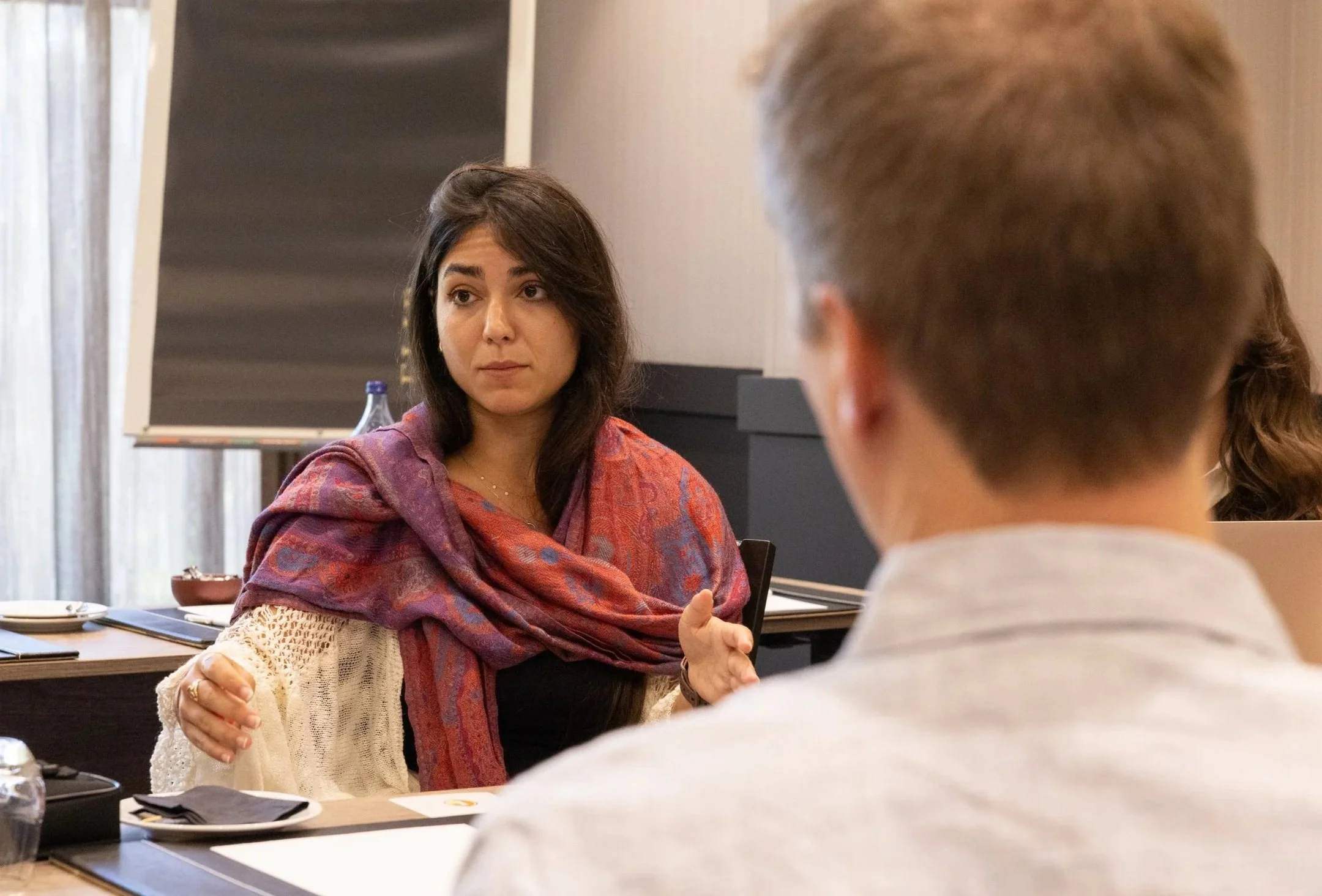 WAI Researcher Janire Castellano Bueno talks to colleagues.