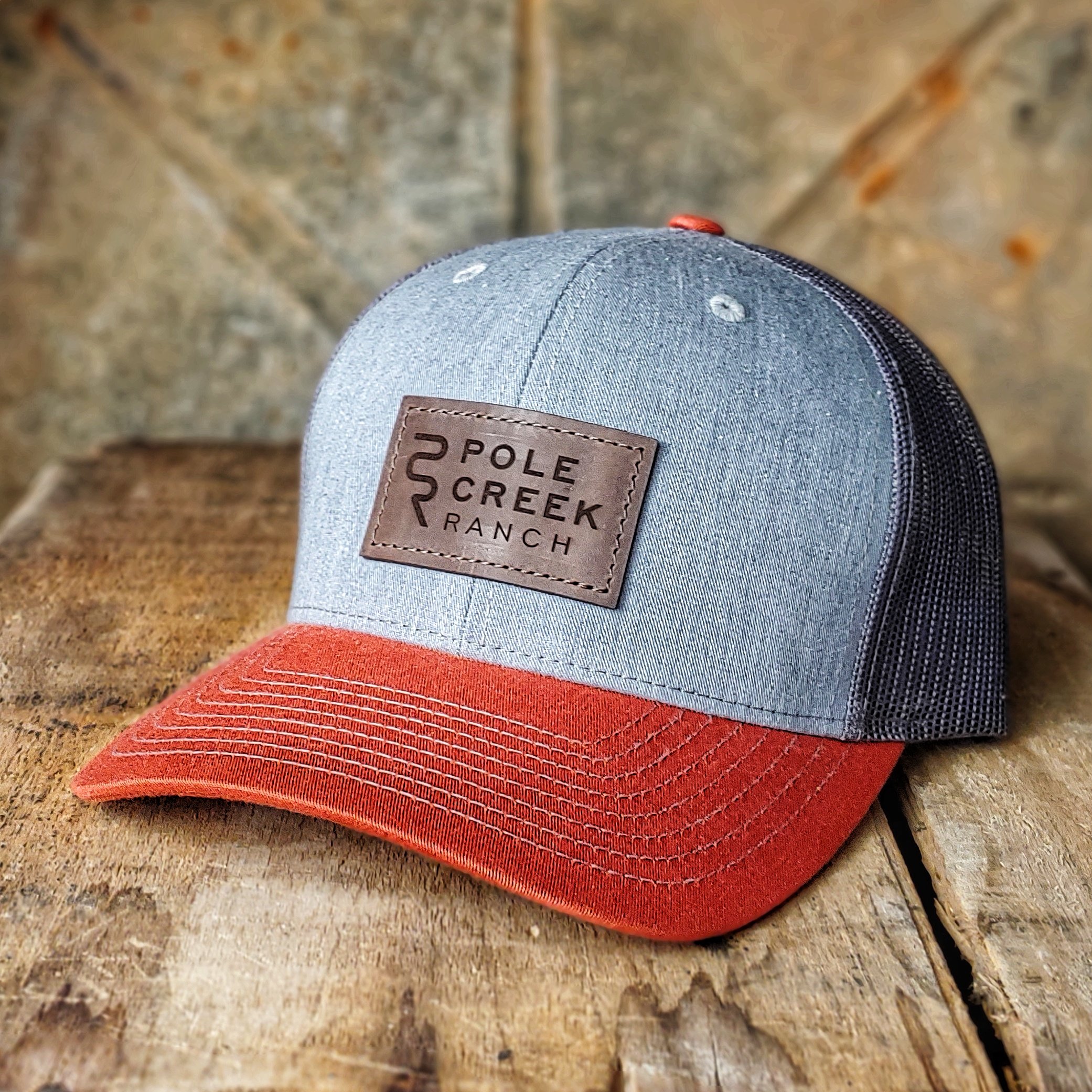 pole-creek-ranch-grey-orange-hat.jpeg