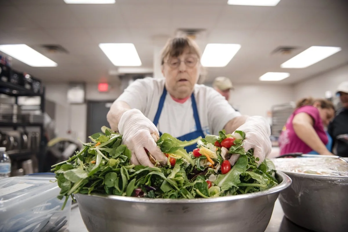 A Volunteer Tossing Salad in New Bern, NC