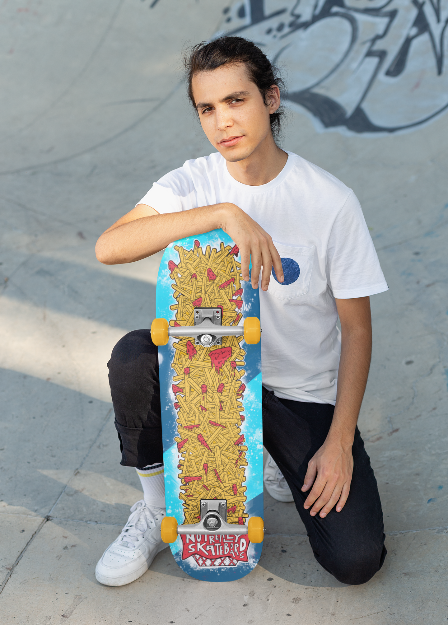 skateboard-mockup-of-a-guy-on-his-knees-in-a-skatepark-27202.png