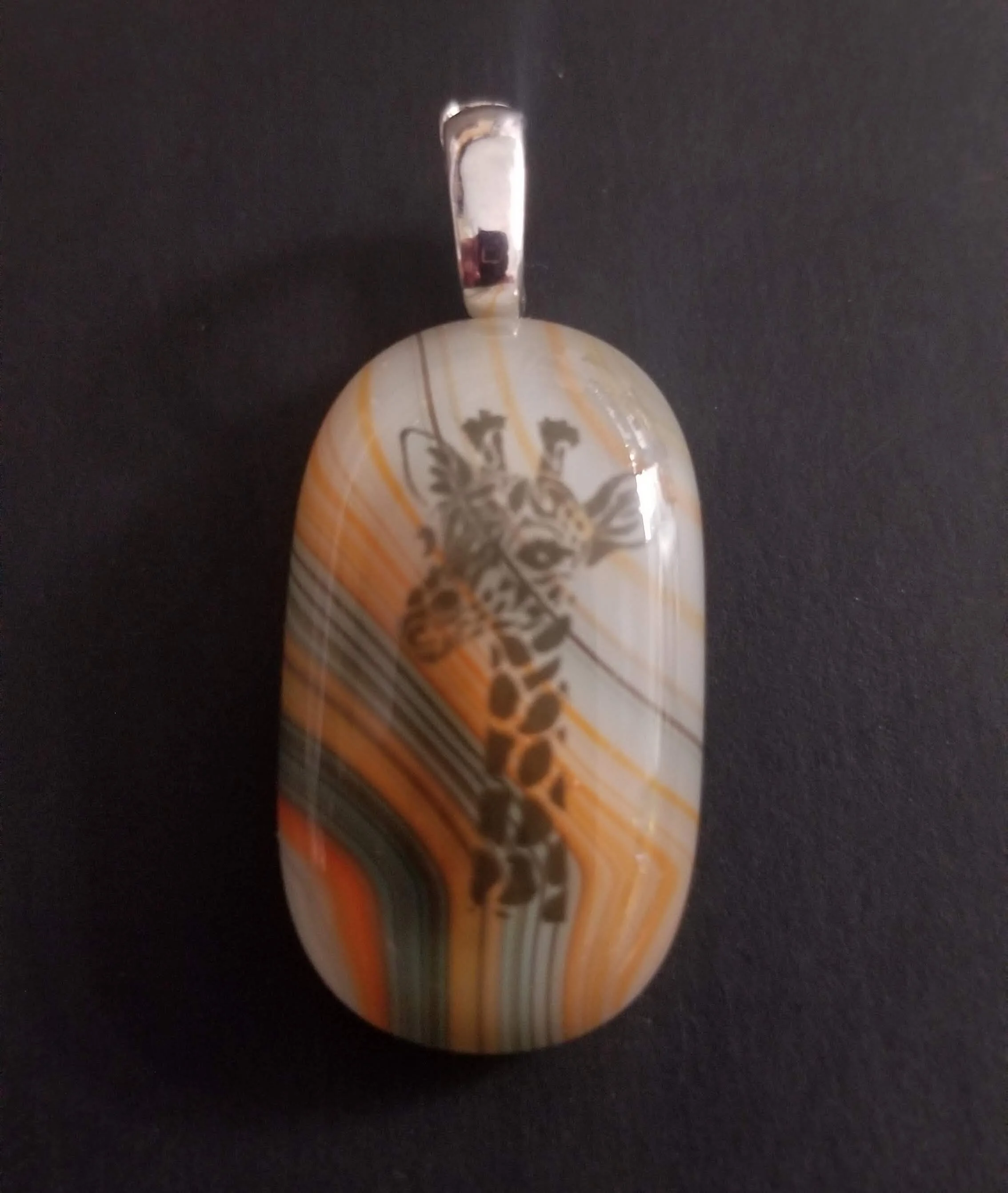 Orange giraffe pendant $15