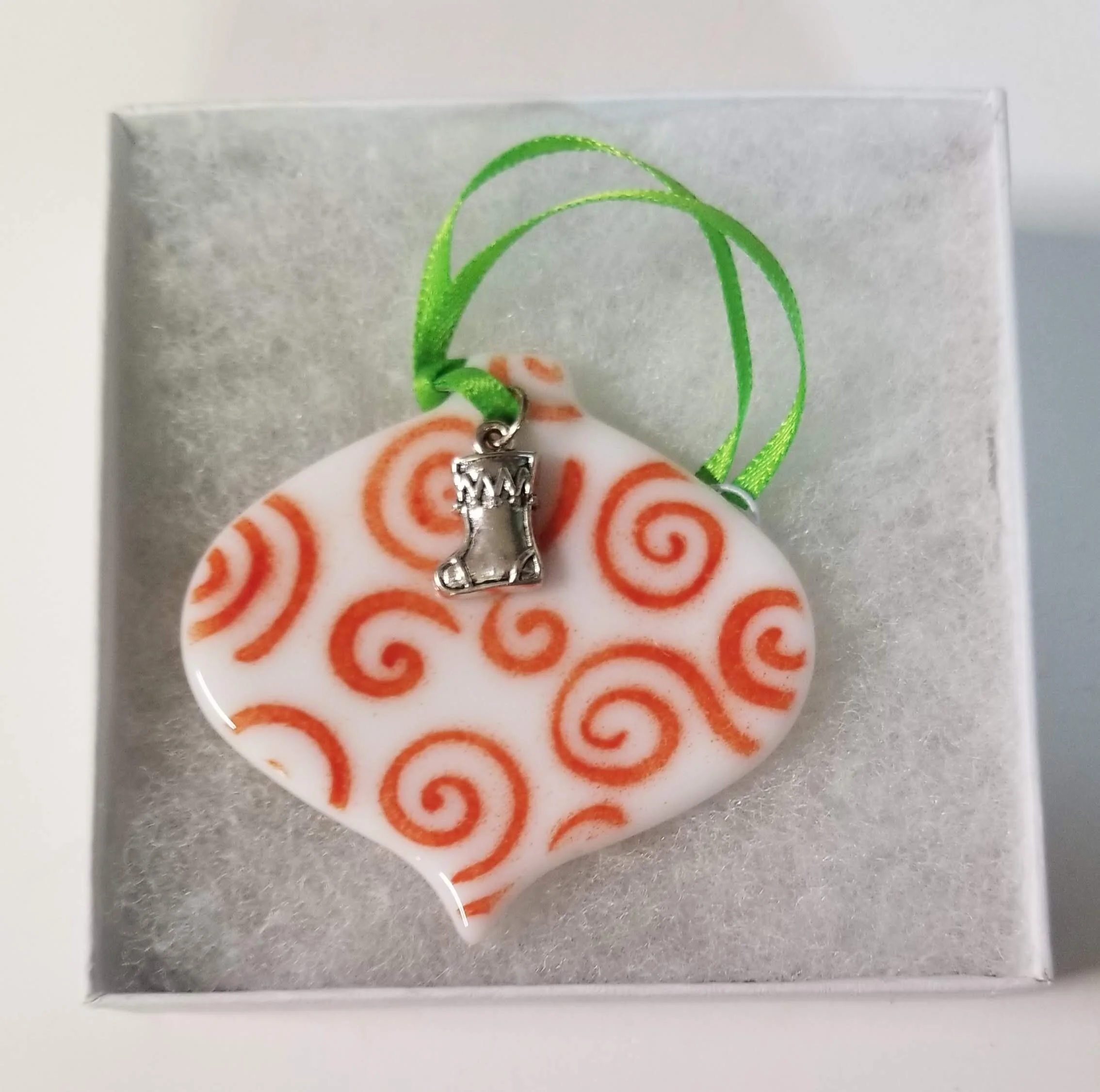 Red swirls with stocking charm, $12