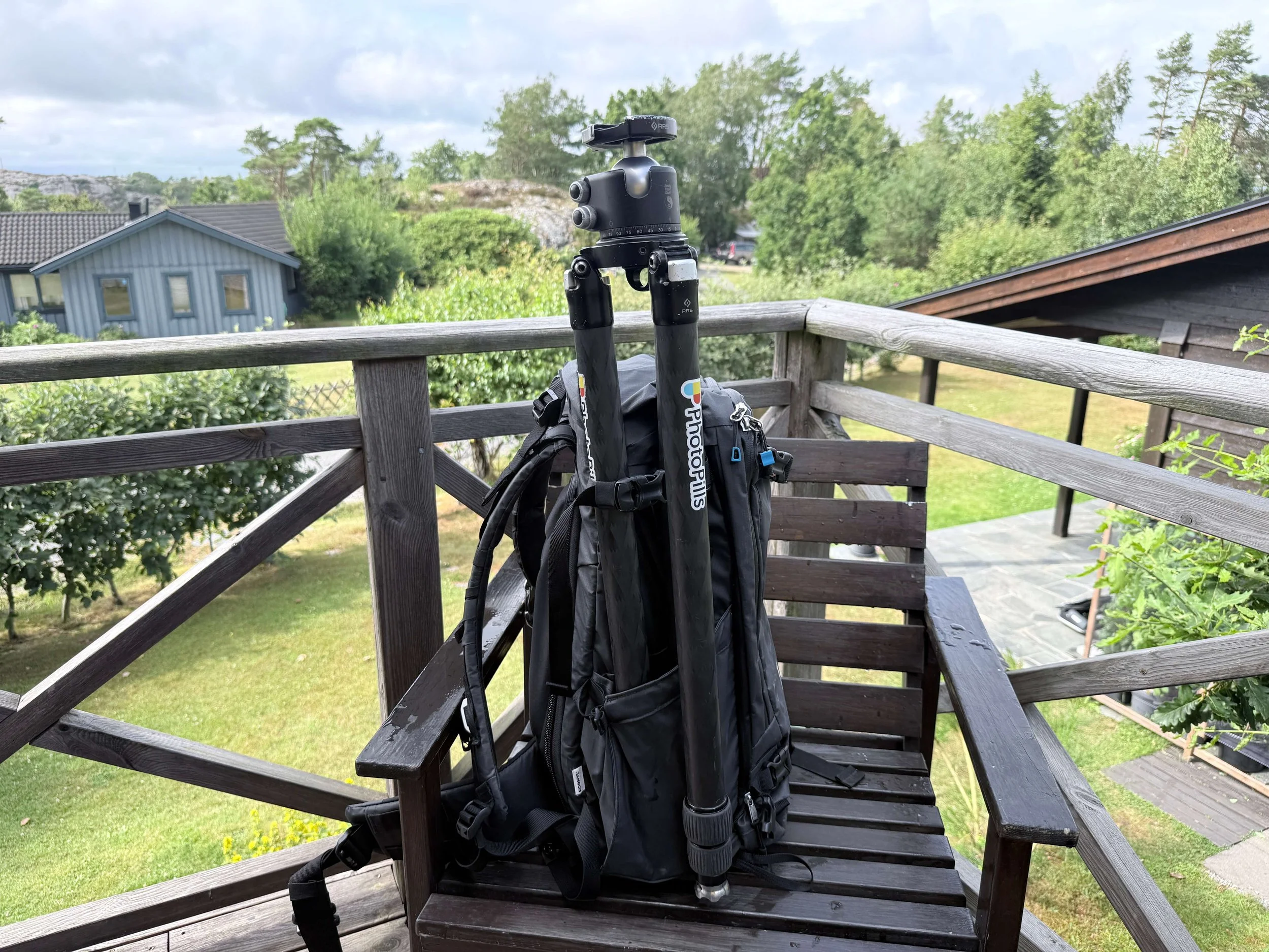 Tripod carried in the taller expandable side pocket of the Nya-Evo Fjord 60-C Gen 4