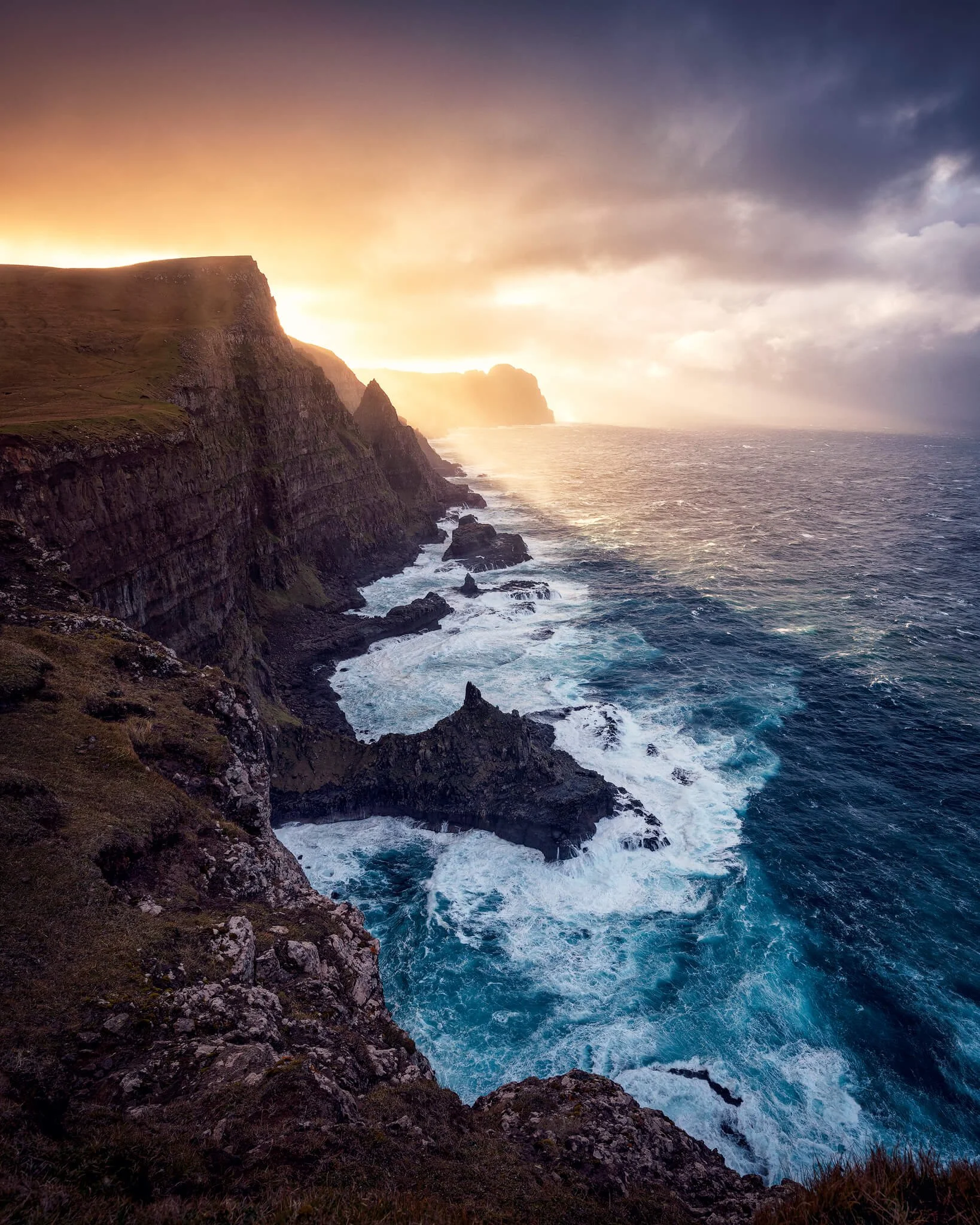 Backlit landscape with the sun in frame and deep shadows that still hold detail.