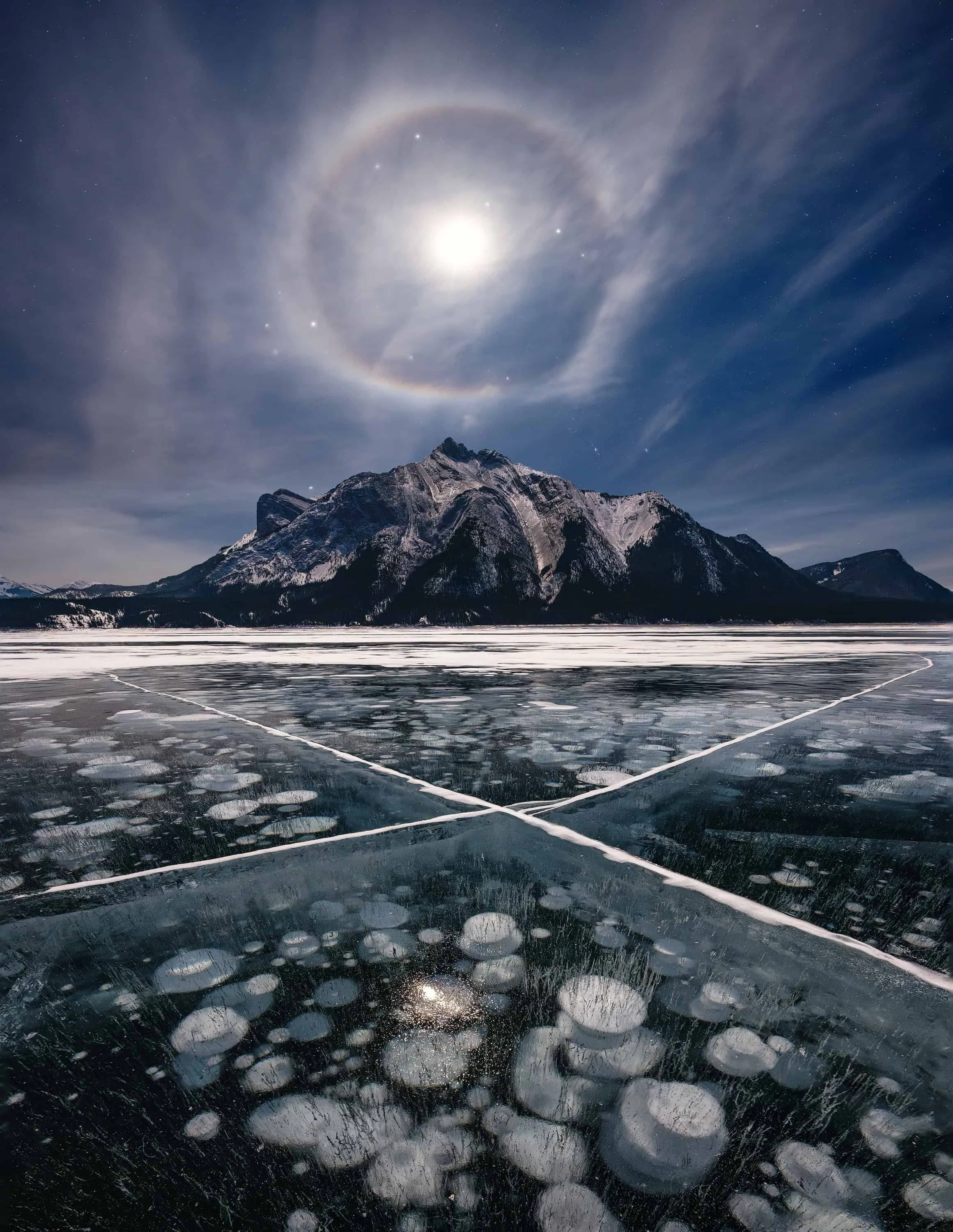 Frozen Methane Bubbles at Abraham Lake at Canada Rockie Mountains shot on Nikon Z8 with Nikkor Z 14-24 f/2.8 S by landscape photographer Felix Inden