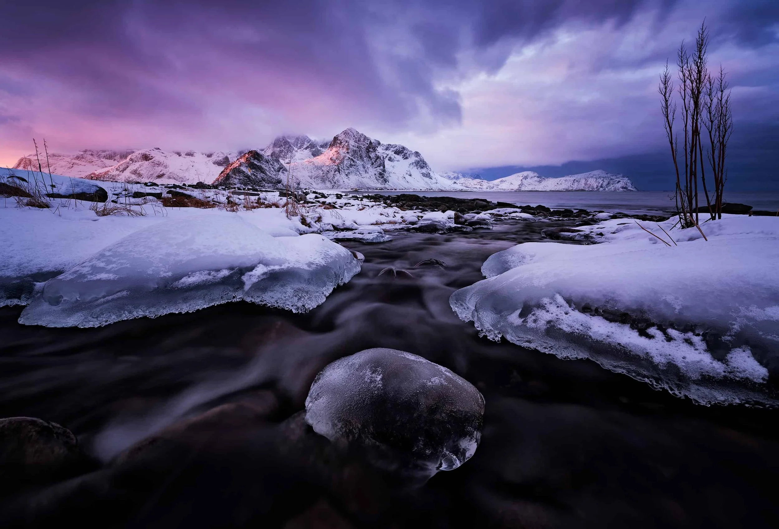 Graphic winter seascape with distant peaks at Vareid, Lofoten, Norway