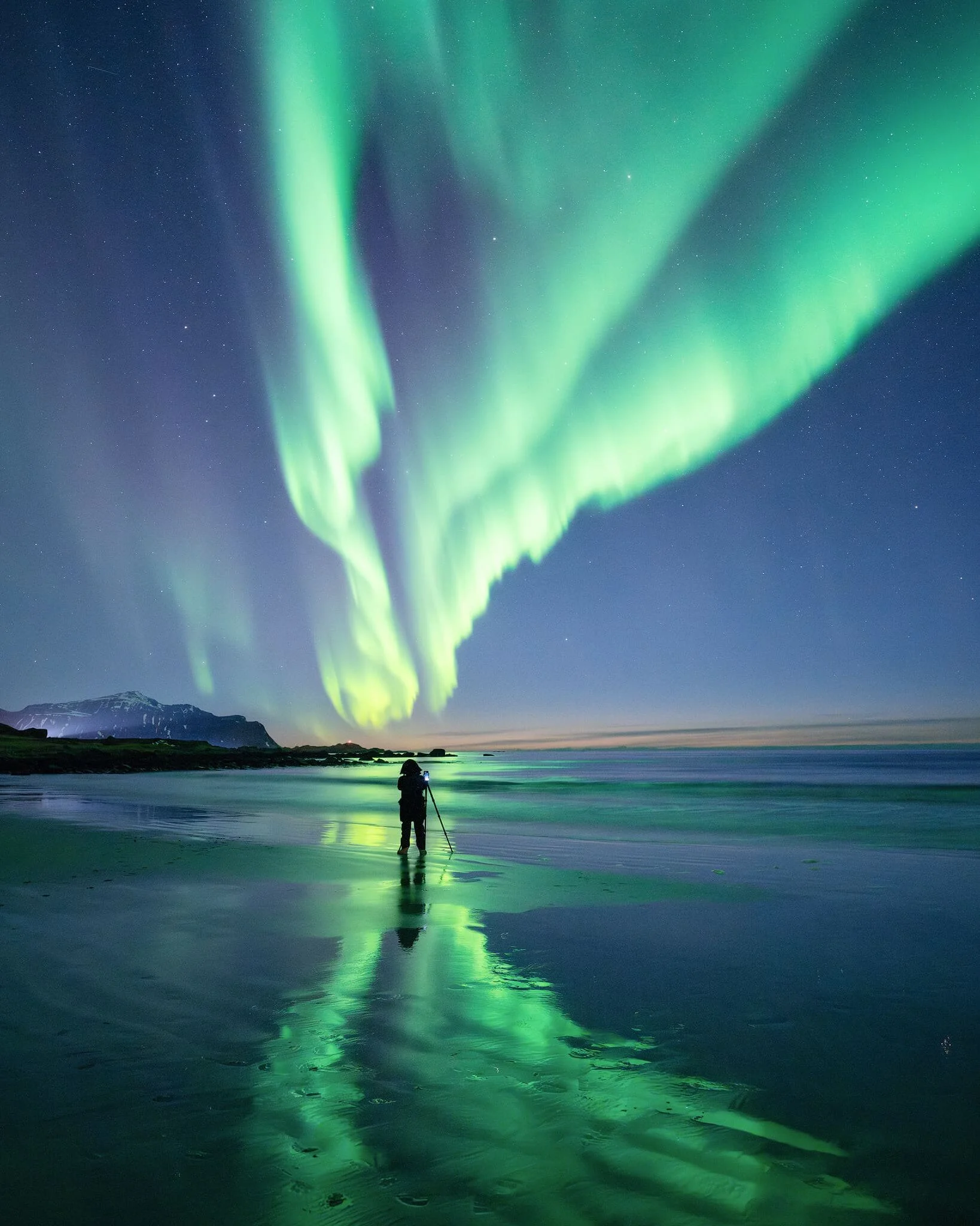 Photographer having a great time capturing the Aurora borealis on Lofoten islands in northern Norway, captured by Felix Inden on a Nikon Z8 with Nikkor Z 14-24 f/2.8 S