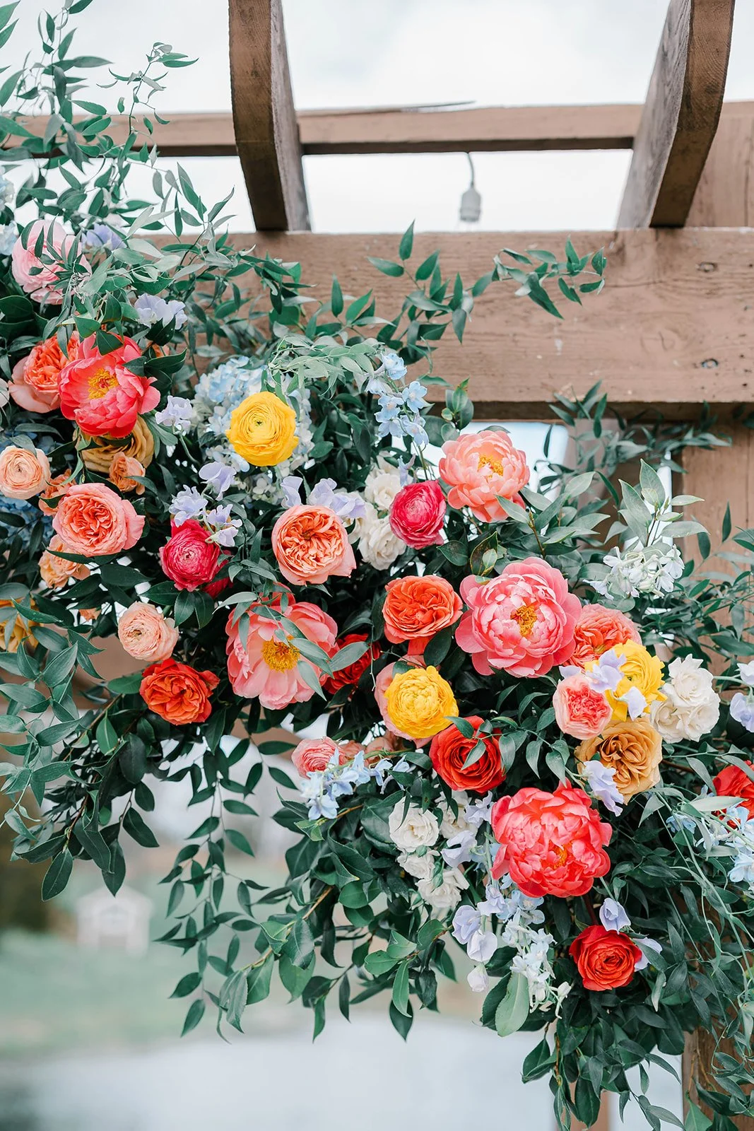 Spring wedding flowers at Bear Brook Valley in New Jersey featuring colorful floral design with peonies, daffodils, and sweet pea