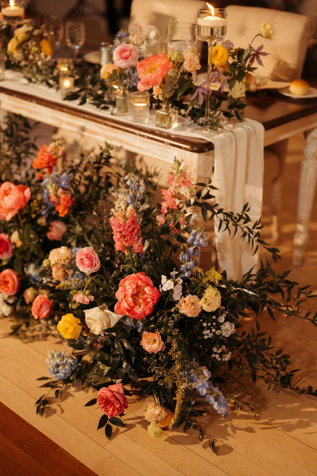 Flower filled Sweetheart Table at Rock Island Lake Club