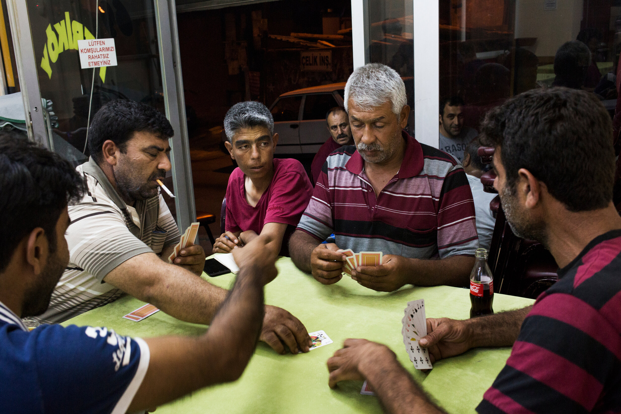  Men play cards at a kahvehane, a traditional Turkish coffee shop frequented by men, in Istanbul, Turkey. 
