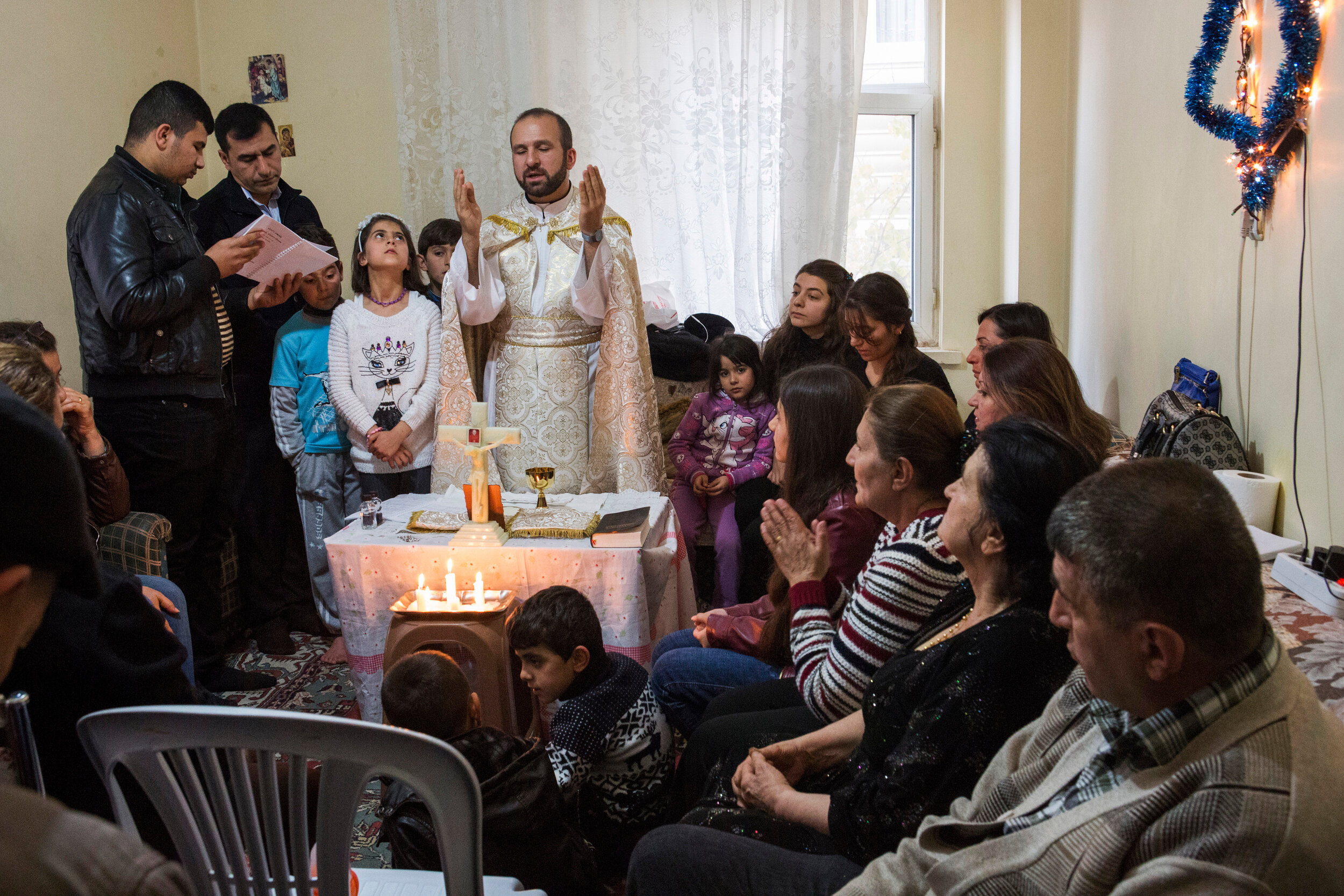 Father Remzi Diril, known as Father Adday, celebrates mass at an home in Kirsehir, Turkey. Father Adday is the only Chaldean Catholic priest in charge of pastoral work in Turkey. Every year he travels across Turkey to tend to the community of Iraqi 