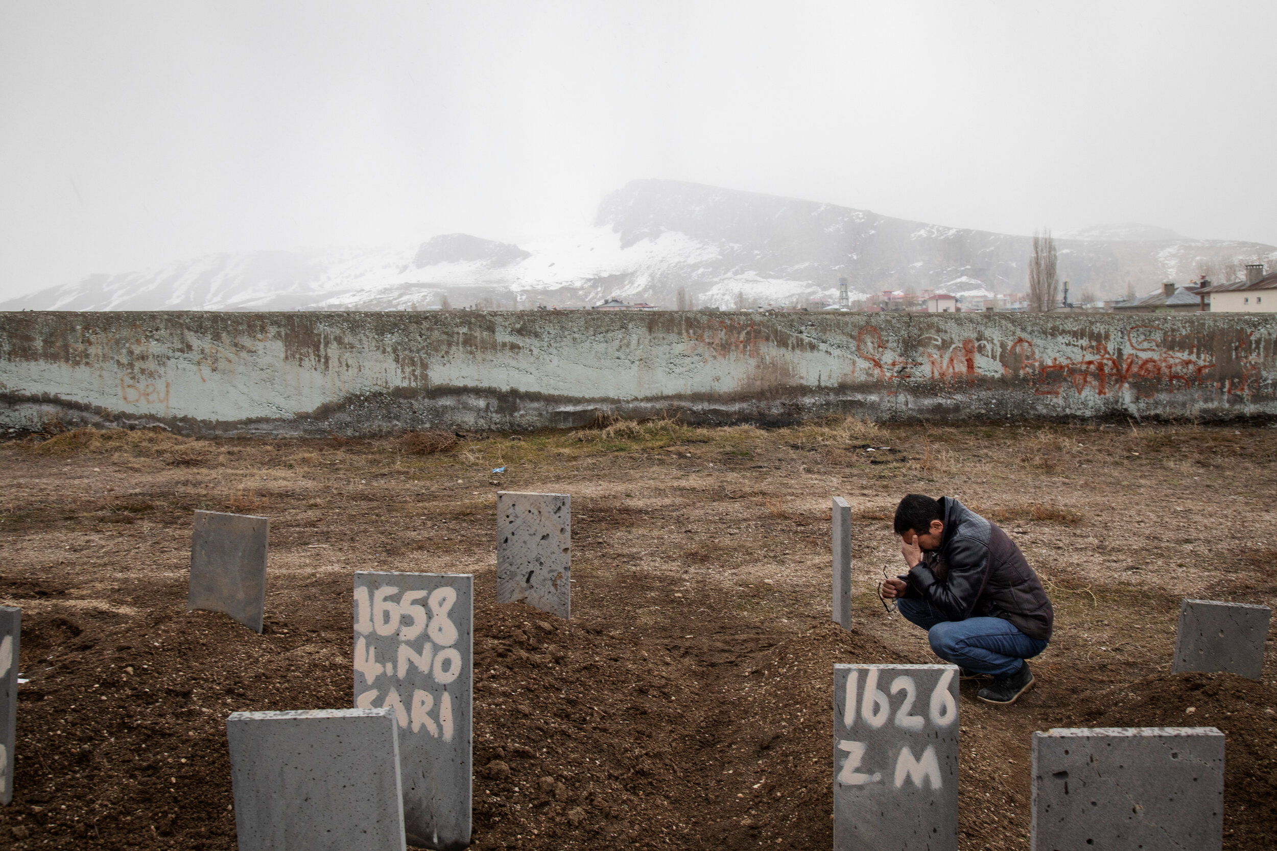  Hamdi visits the grave of his daughter Zehra in a cemetery for the unidentified in Van, Turkey. The family left Afghanistan after receiving threats from the Taliban. The family paid smugglers to take them to Europe via Iran and Turkey. In Turkey, th