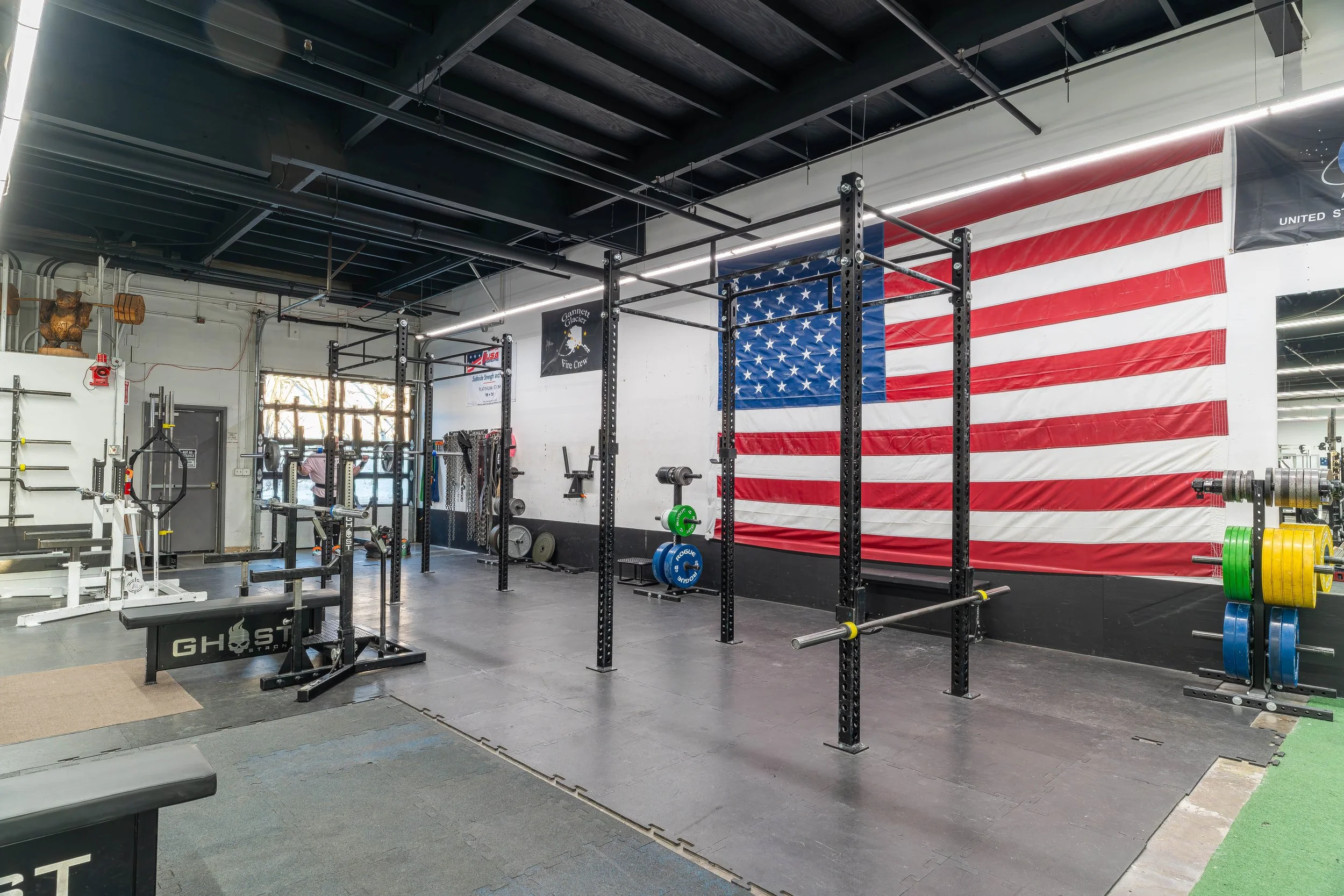 Squat racks and barbell training area at Southside Strength and Fitness in Anchorage, Alaska