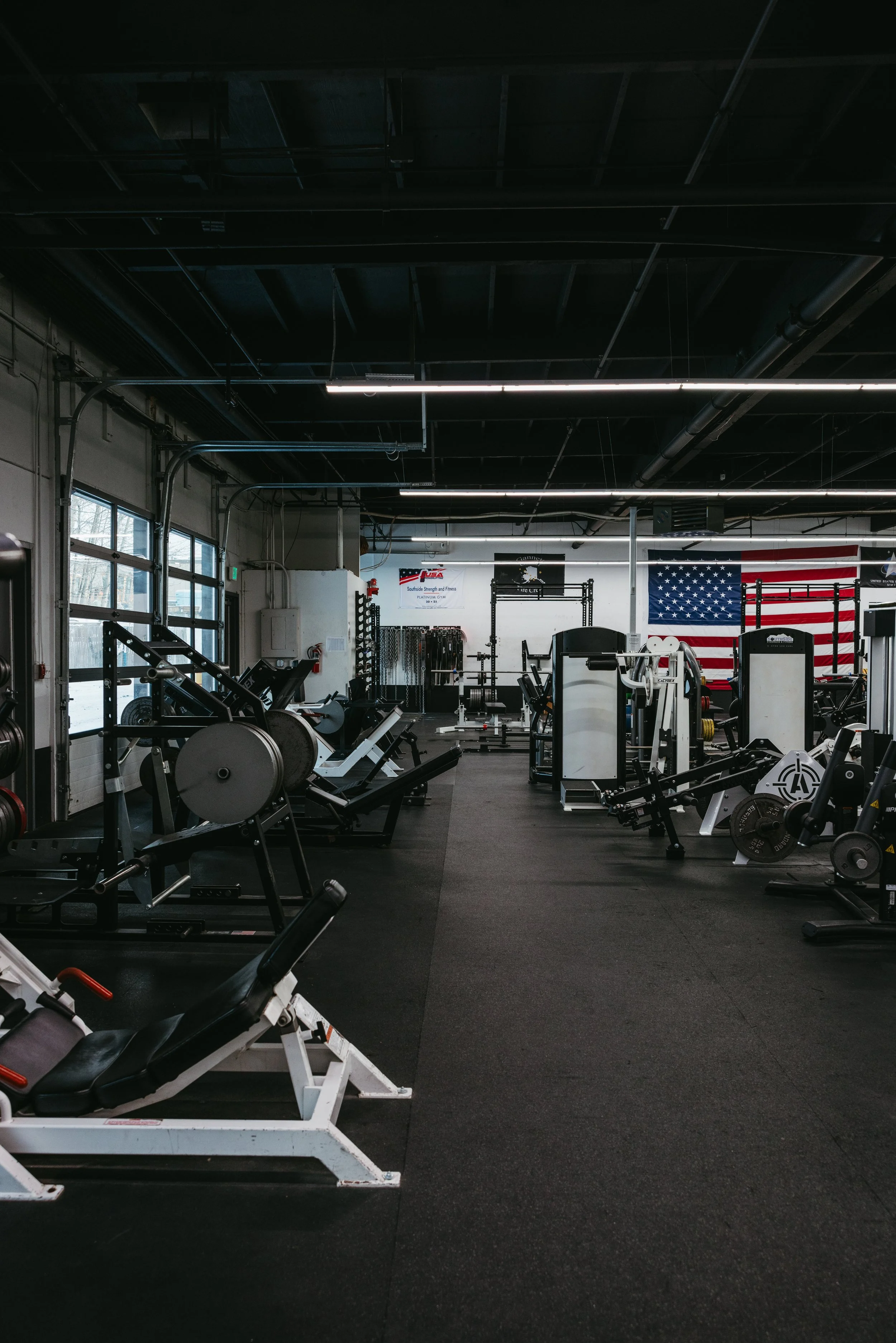 Strength training floor with machines and free weights inside Southside Strength and Fitness in Anchorage, Alaska