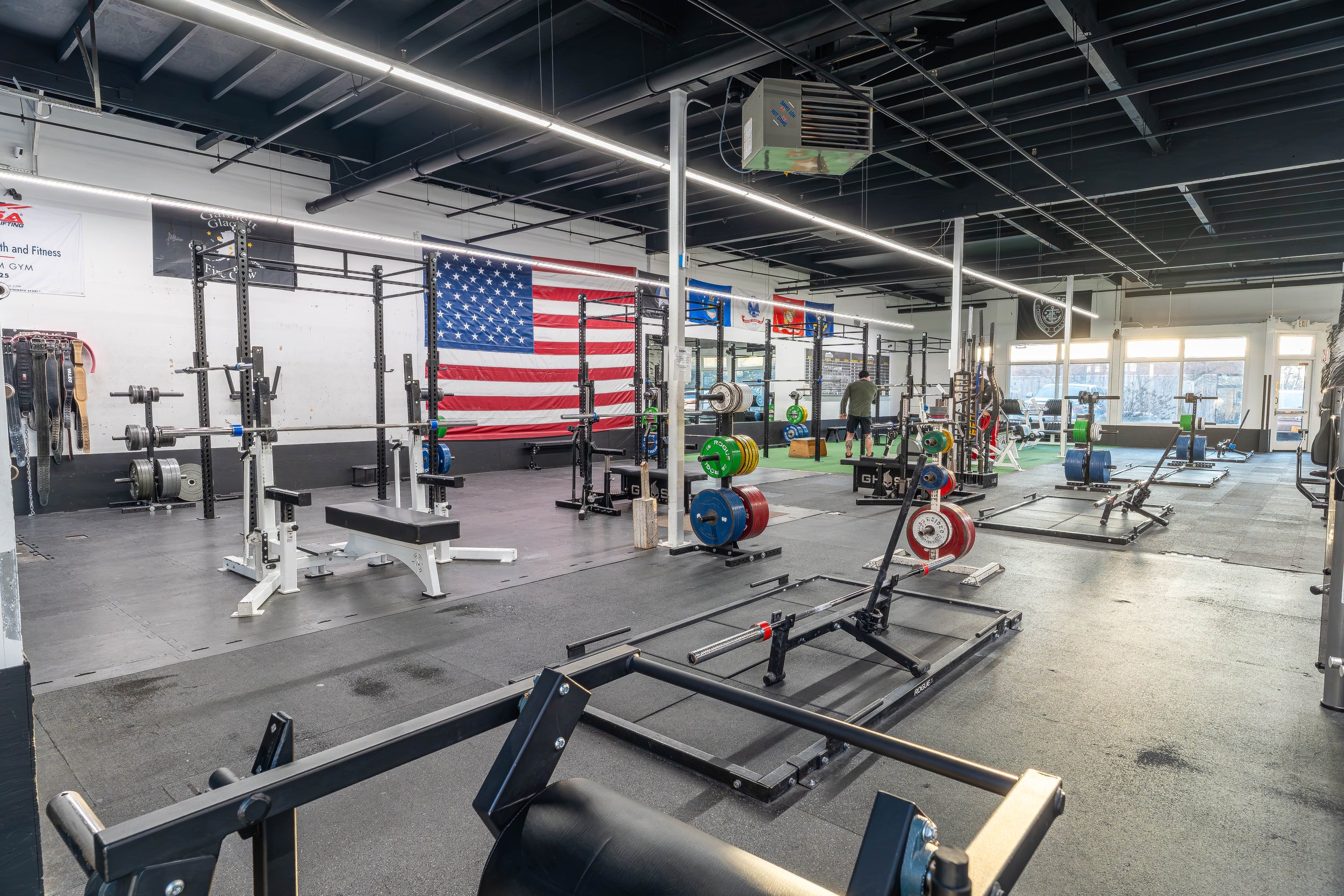 Powerlifting-focused training area at Southside Strength and Fitness with dedicated platforms, competition-style racks, and calibrated plates designed for serious strength training.