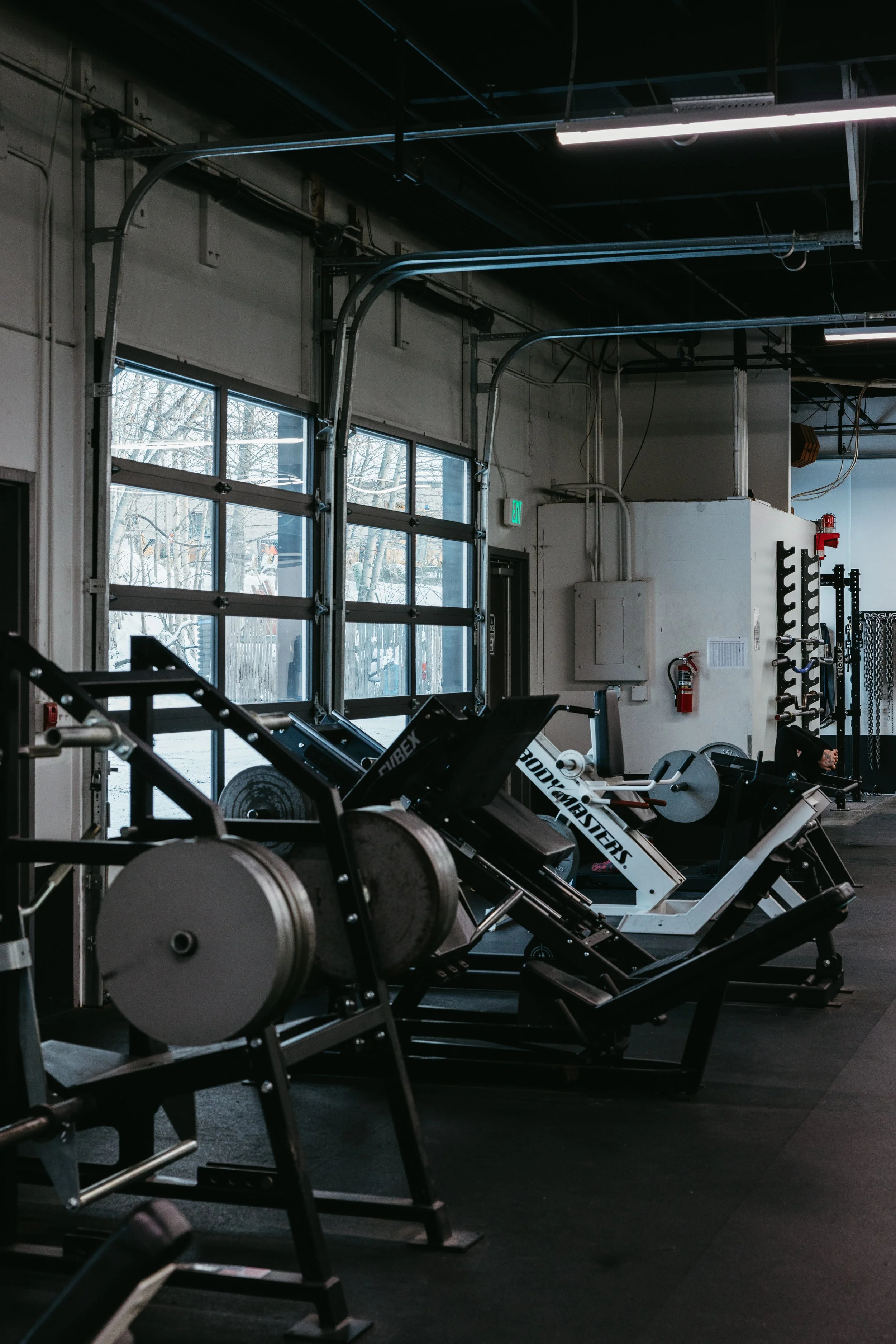 Plate-loaded strength machines lined along the training floor at Southside Strength and Fitness in Anchorage, Alaska