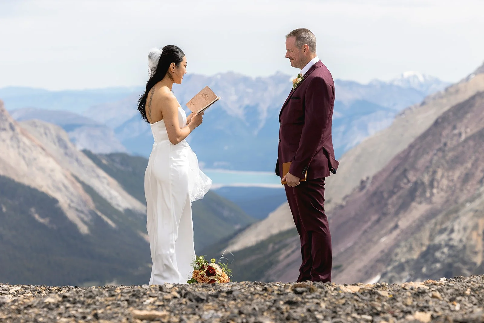 heli-elopement-private-vows-on-a-dramatic-cliff-in-banff-with-Wild-Alpine-Image-Co.-Banff's-best-elopement-photographers