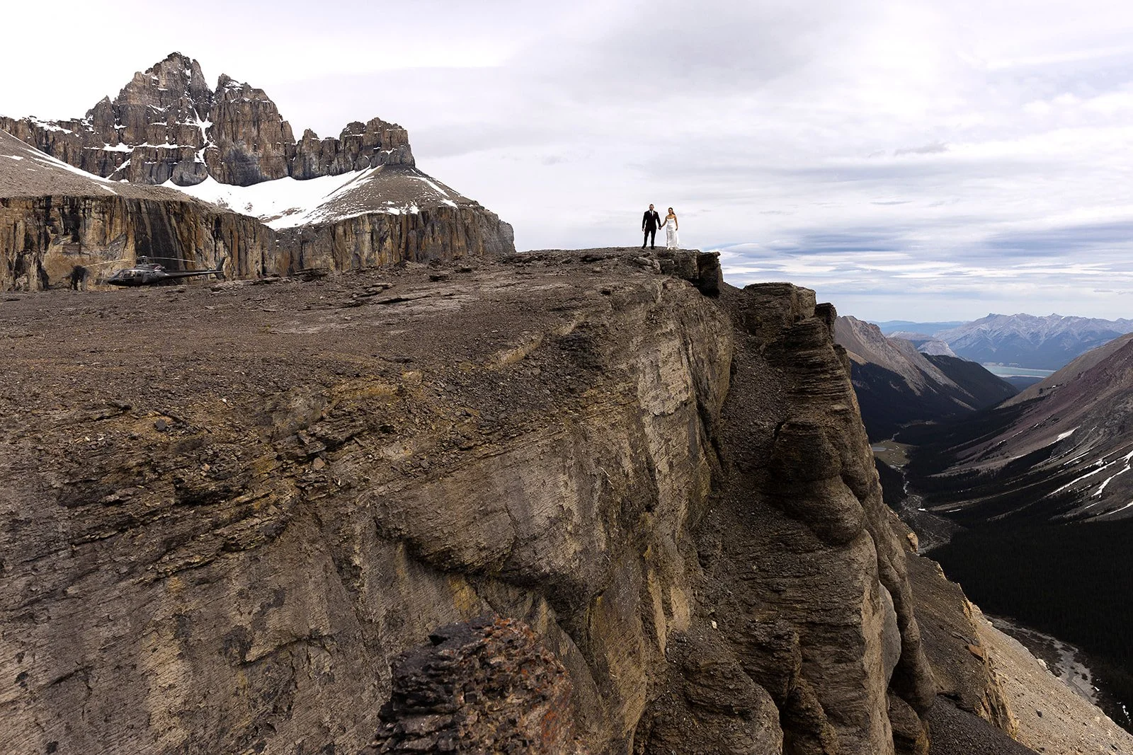 heli-elopement-on-a-dramatic-cliff-in-banff-with-Wild-Alpine-Image-Co.-Banff's-best-elopement-photographers