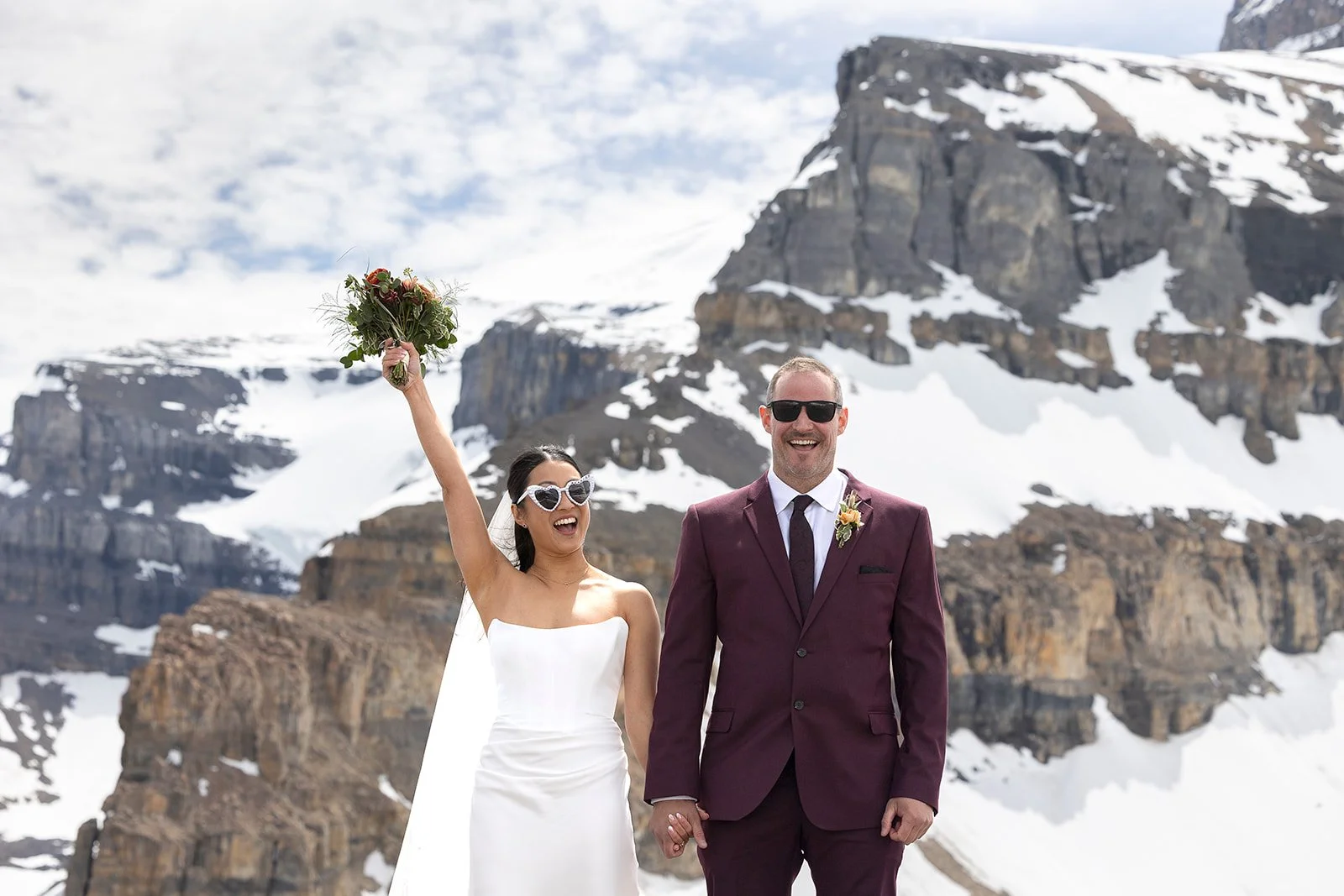 heli-elopement-private-vows-on-a-dramatic-cliff-in-banff-with-Wild-Alpine-Image-Co.-Banff's-best-elopement-photographers