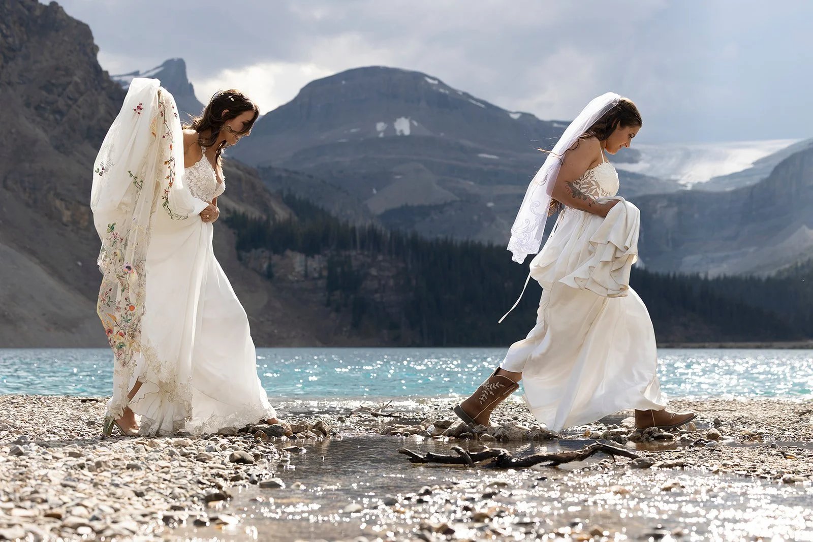 moody-skies-and-beautiful-light-for-this-same-sex-elopement-on-the-shores-of-bow-lake-with-Banff's-local-elopement-photographers-Wild-Alpine-Image-Co.