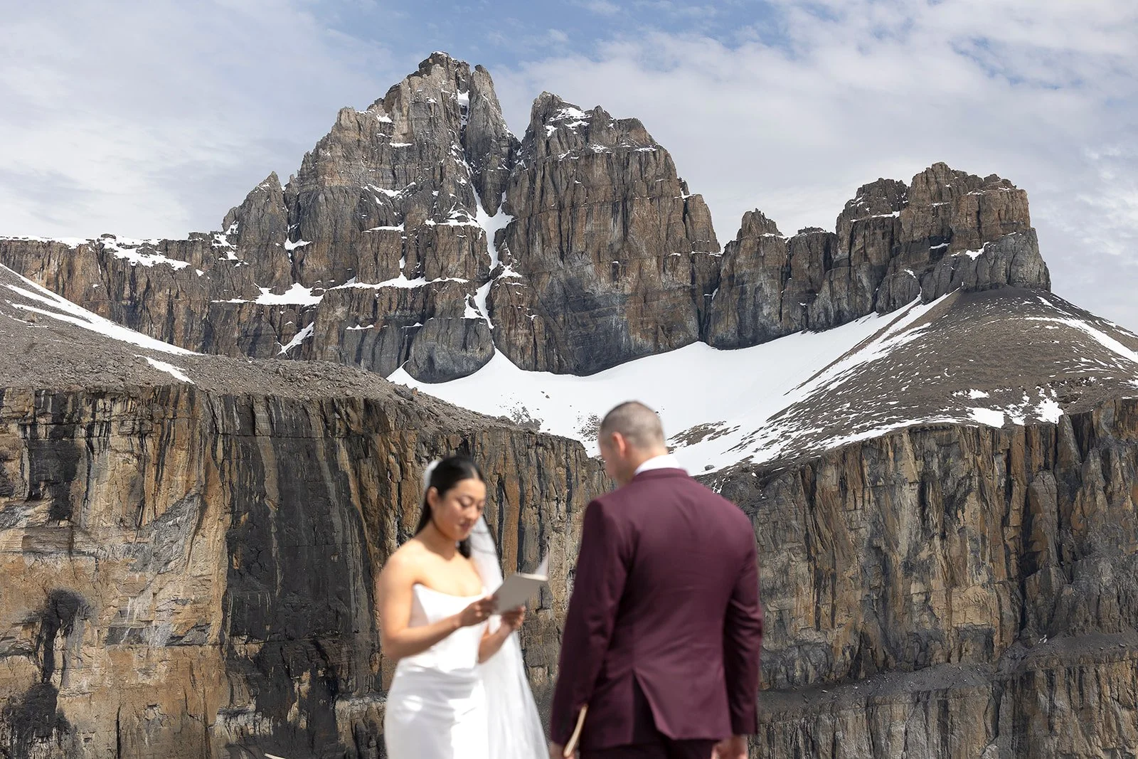 heli-elopement-private-vows-on-a-dramatic-cliff-in-banff-with-Wild-Alpine-Image-Co.-Banff's-best-elopement-photographers