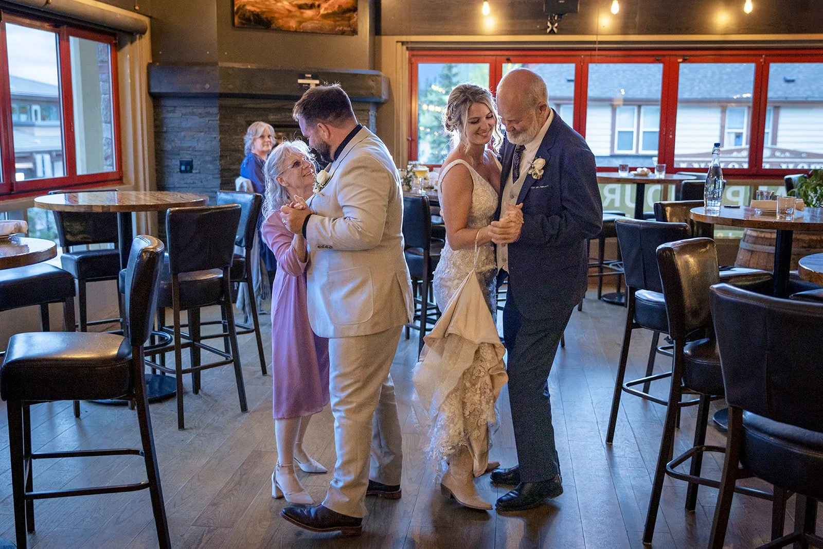 elopement-dinner-and-first-dances-at-Murrieta's-bar-and-grill-photographed-by-Canmore's-bespoke-elopement-planners-and-photographers-Wild-Alpine-Image-Co.
