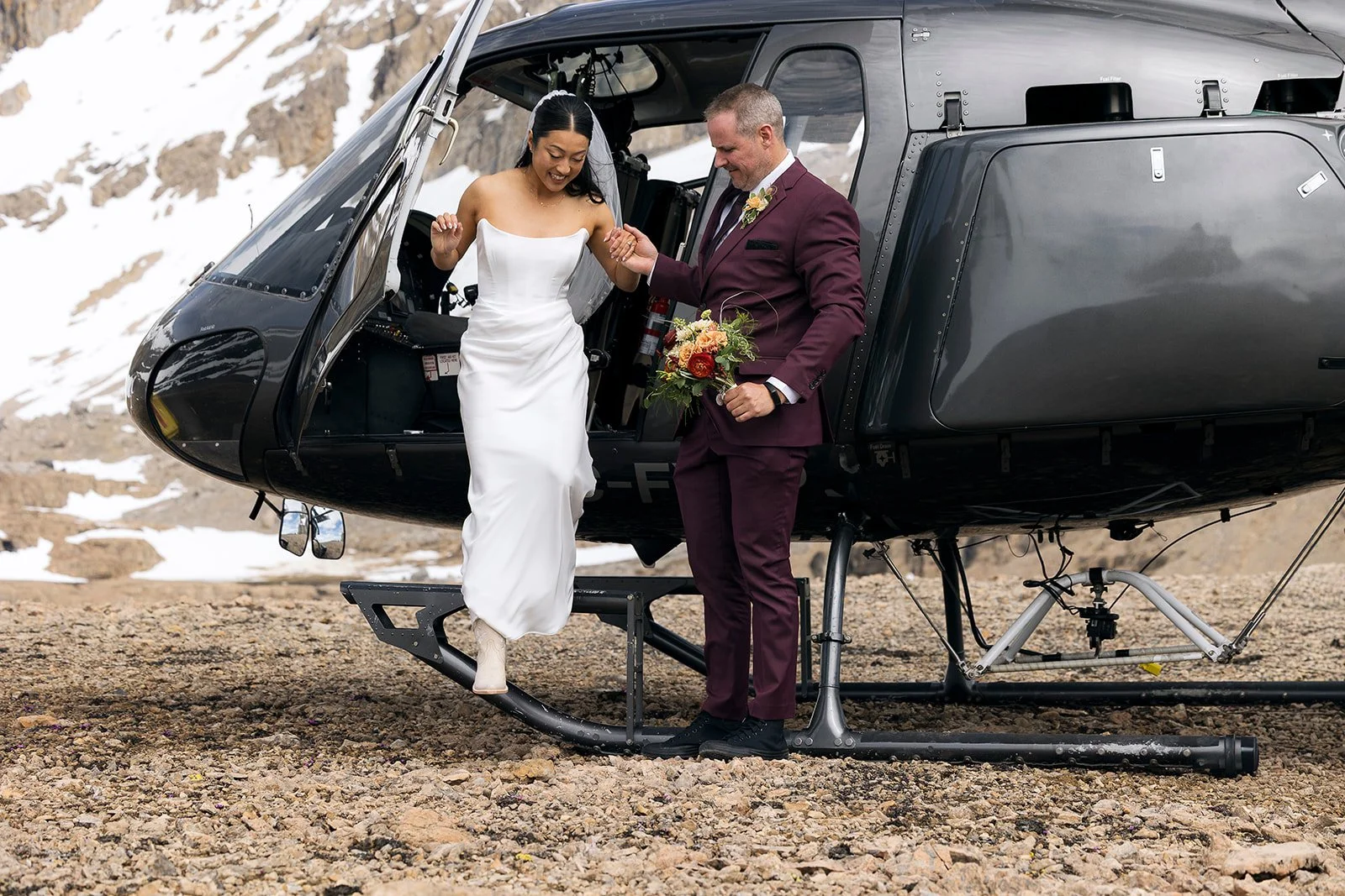heli-elopement-private-vows-on-a-dramatic-cliff-in-banff-with-Wild-Alpine-Image-Co.-Banff's-best-elopement-photographers
