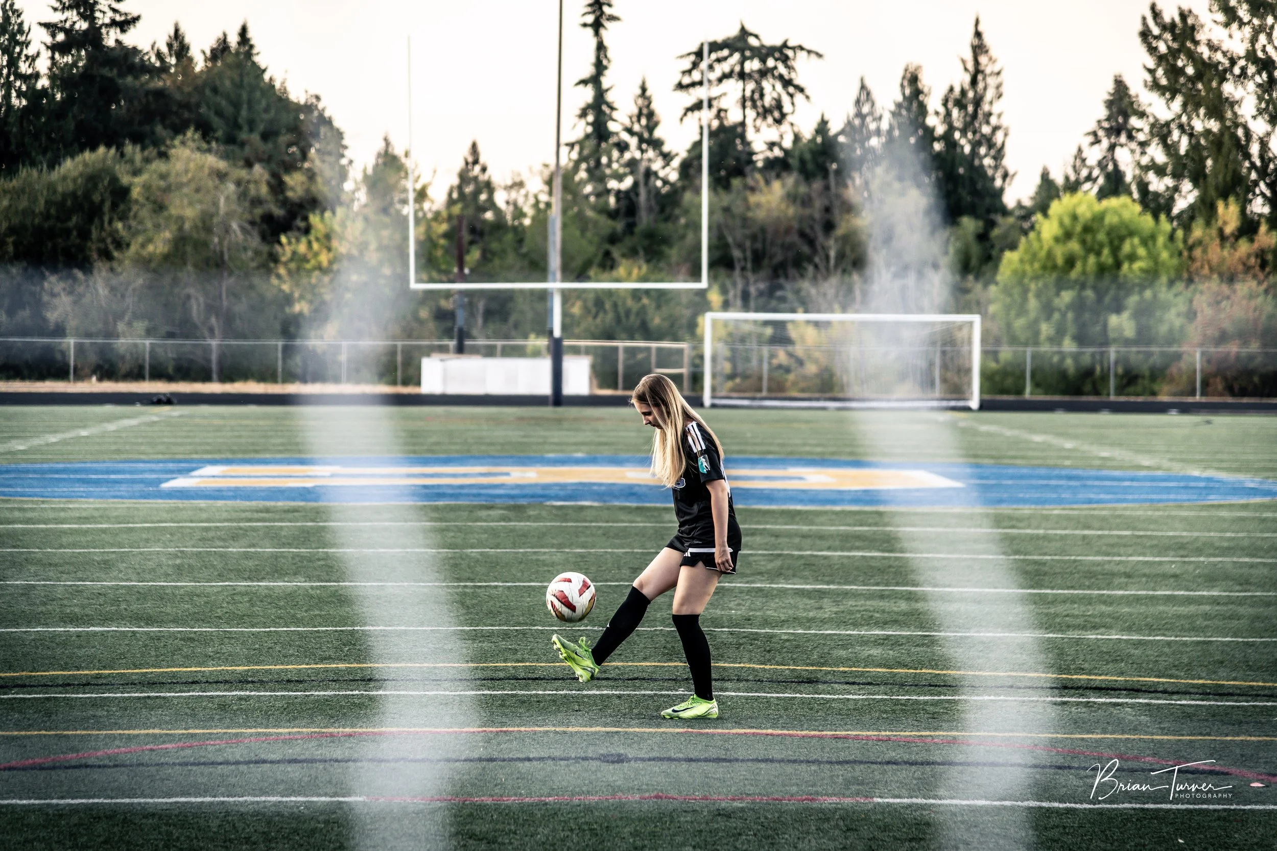 Senior portrait of a high school girl during a soccer session in Ridgefield WA by Brian Turner Photography