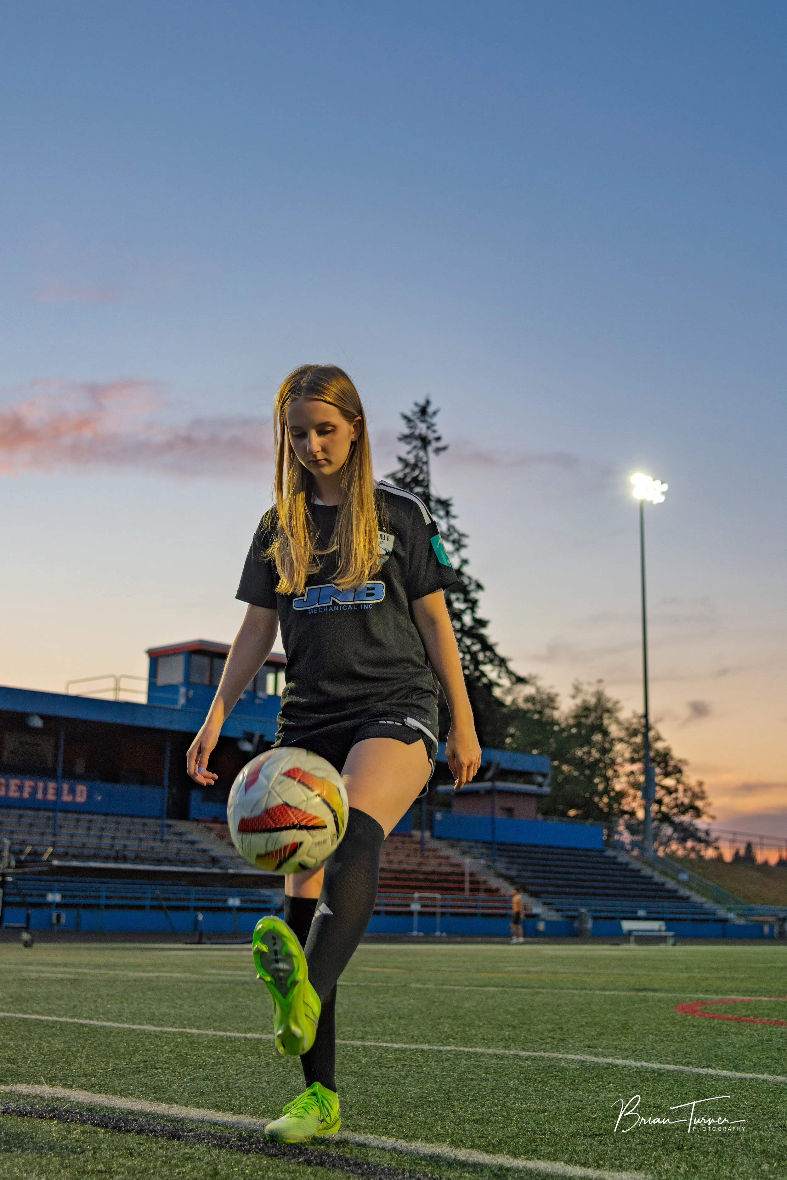 Senior portrait of a high school girl during a soccer session in Ridgefield WA by Brian Turner Photography