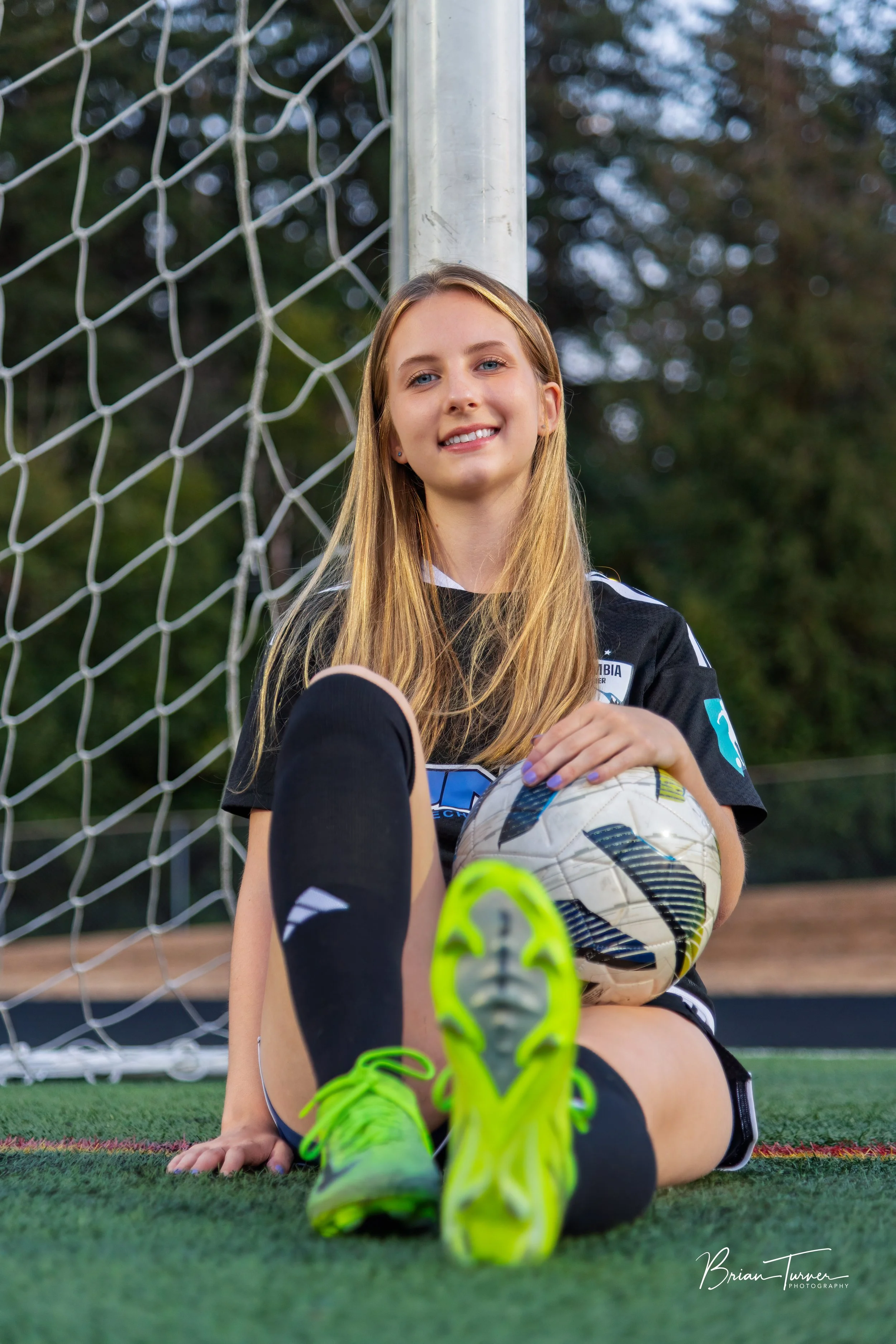 Senior portrait of a high school girl during a soccer session in Ridgefield WA by Brian Turner Photography