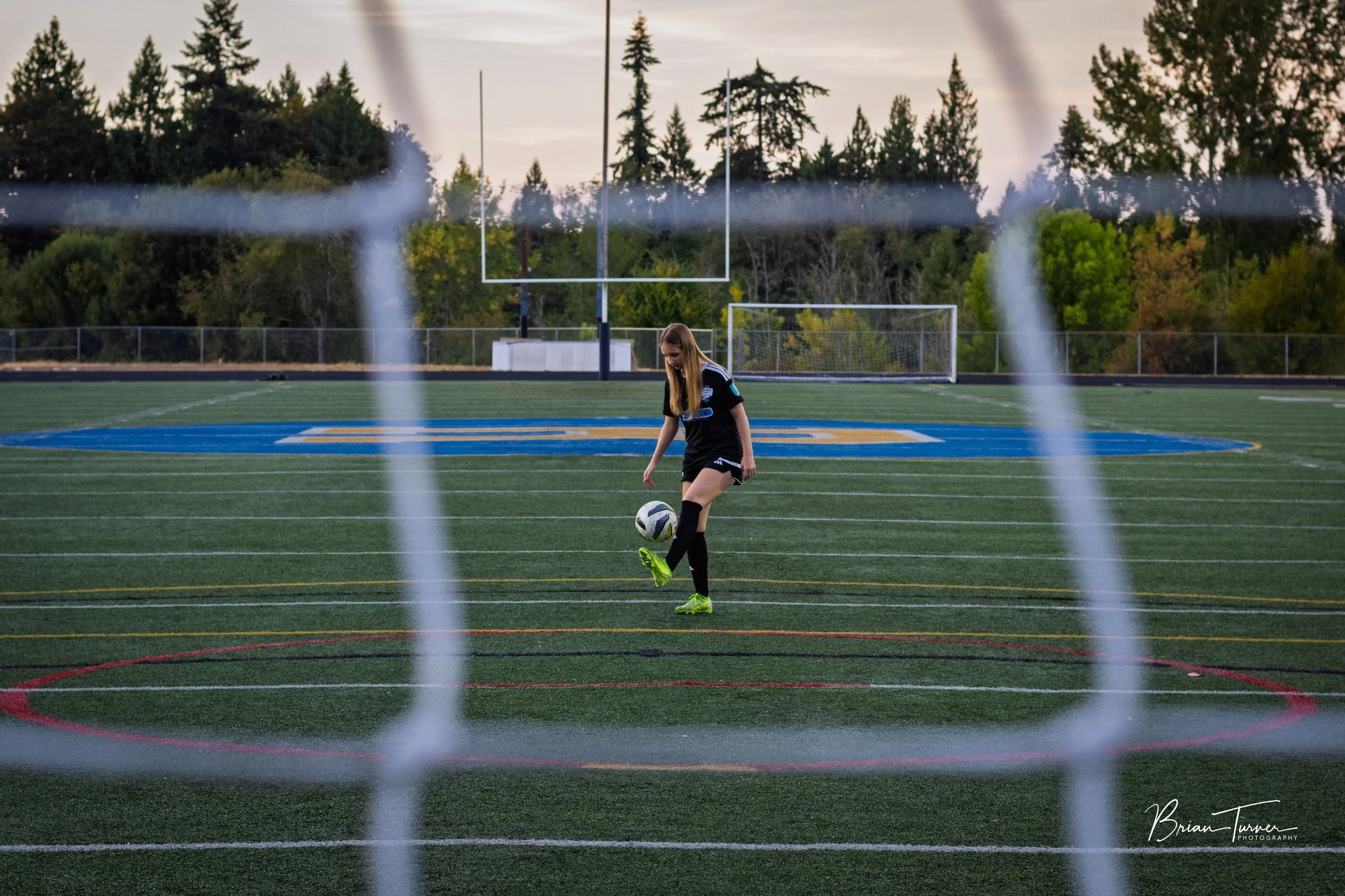Senior portrait of a high school girl during a soccer session in Ridgefield WA by Brian Turner Photography