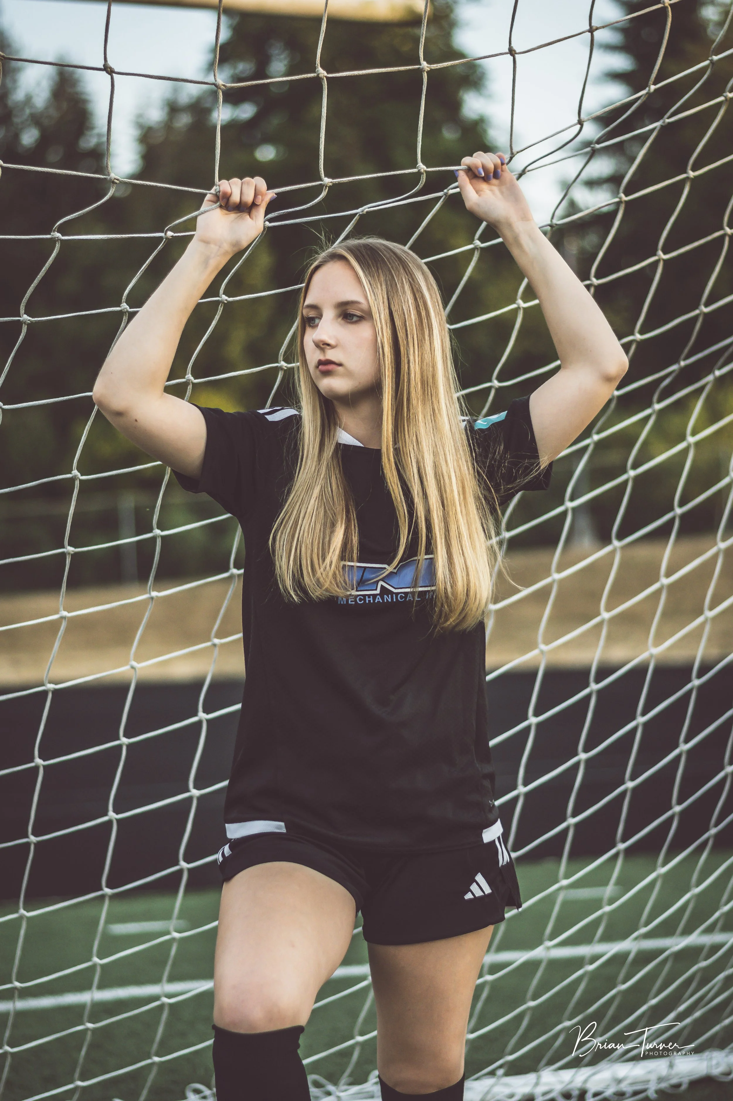 Senior portrait of a high school girl during a soccer session in Ridgefield WA by Brian Turner Photography