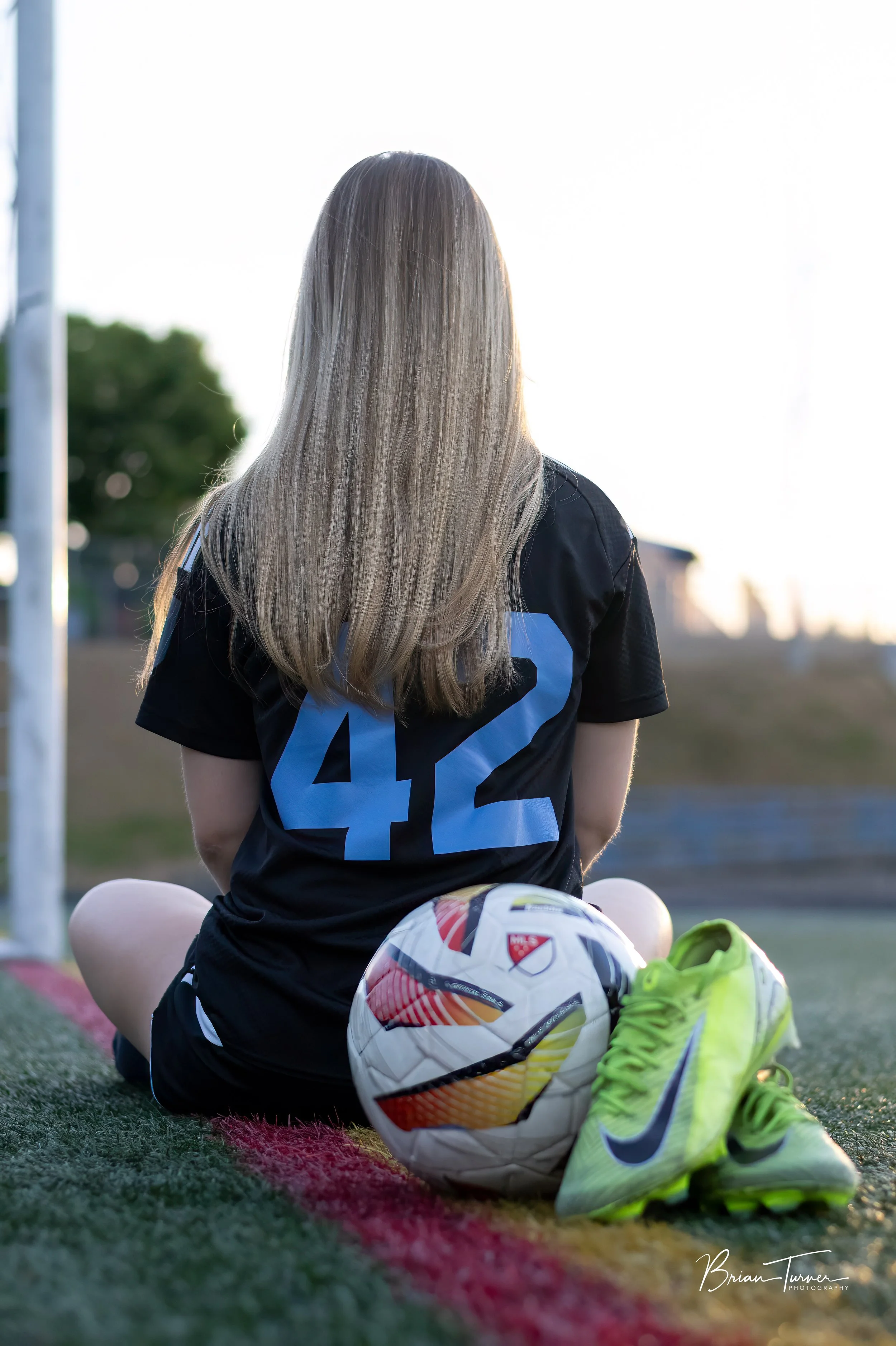 Senior portrait of a high school girl during a soccer session in Ridgefield WA by Brian Turner Photography