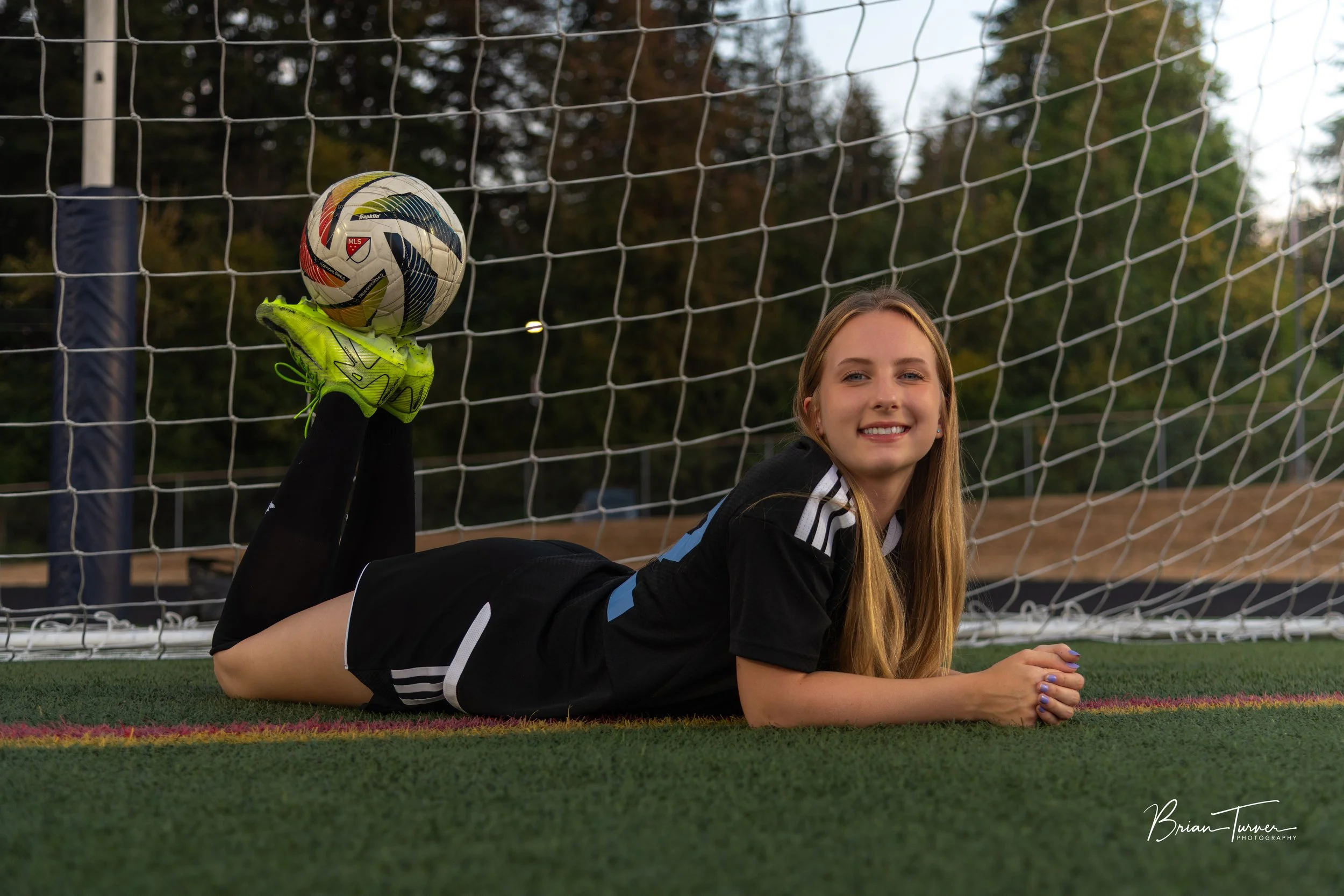 Senior portrait of a high school girl during a soccer session in Ridgefield WA by Brian Turner Photography
