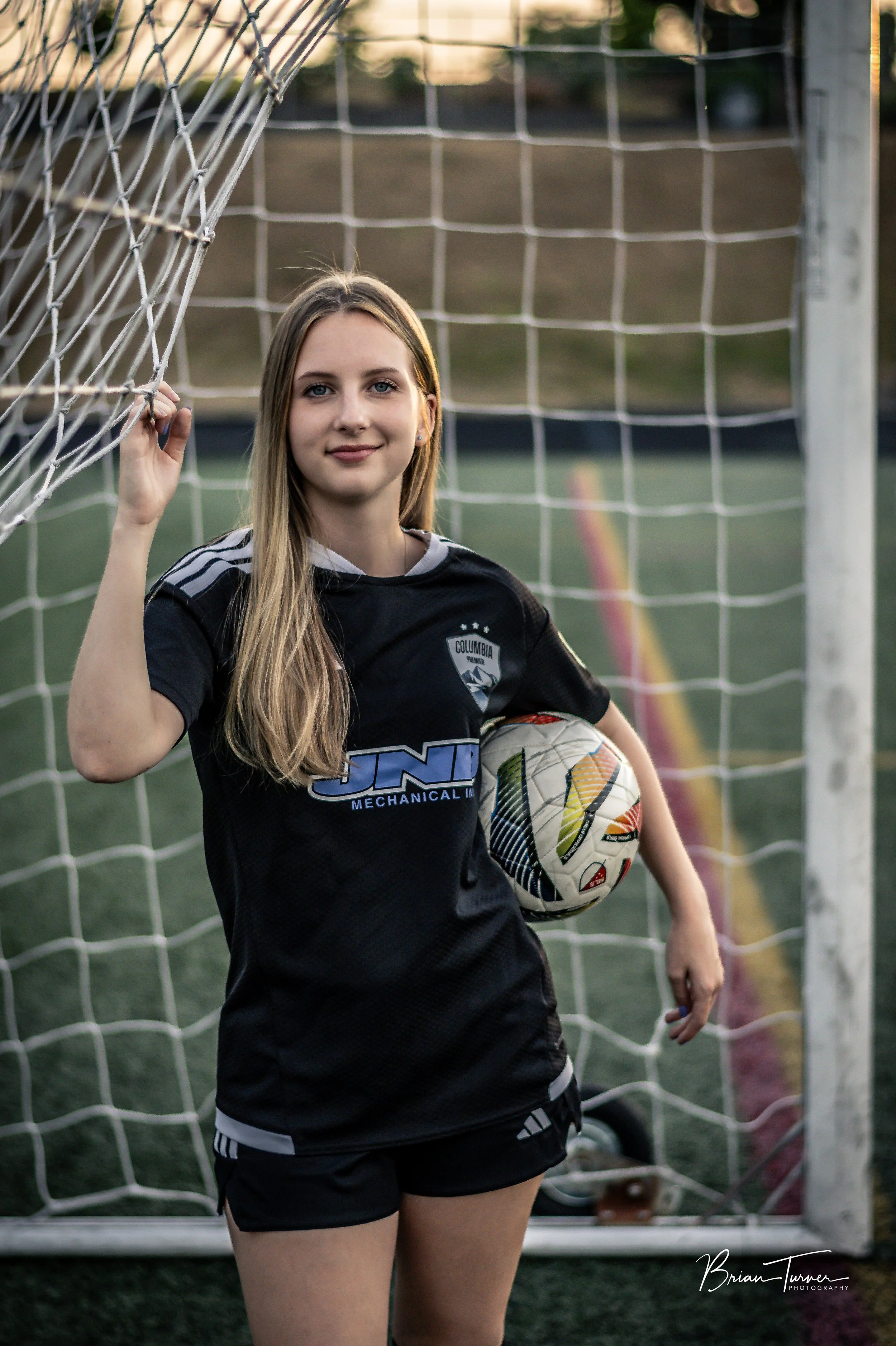 Senior portrait of a high school girl during a soccer session in Ridgefield WA by Brian Turner Photography