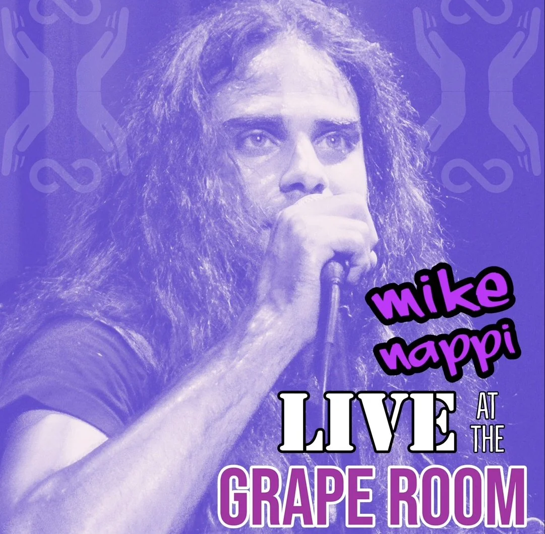 A promotional poster for a live performance by Mike Happi at the Grape Room, featuring a photo of a man with long, curly hair holding a microphone, with a purple background and decorative logos.