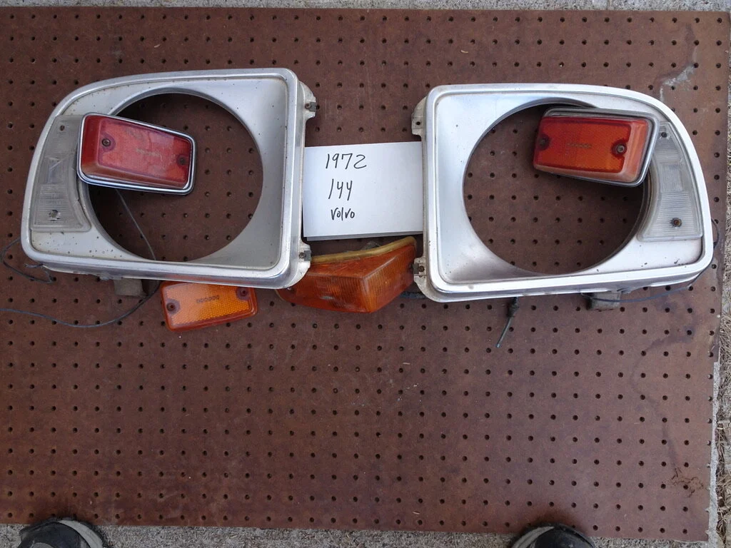 1972 Volvo 140 Head light doors & Side markers.
 Head light doors $50. pr
Markers $50 sets of 2 