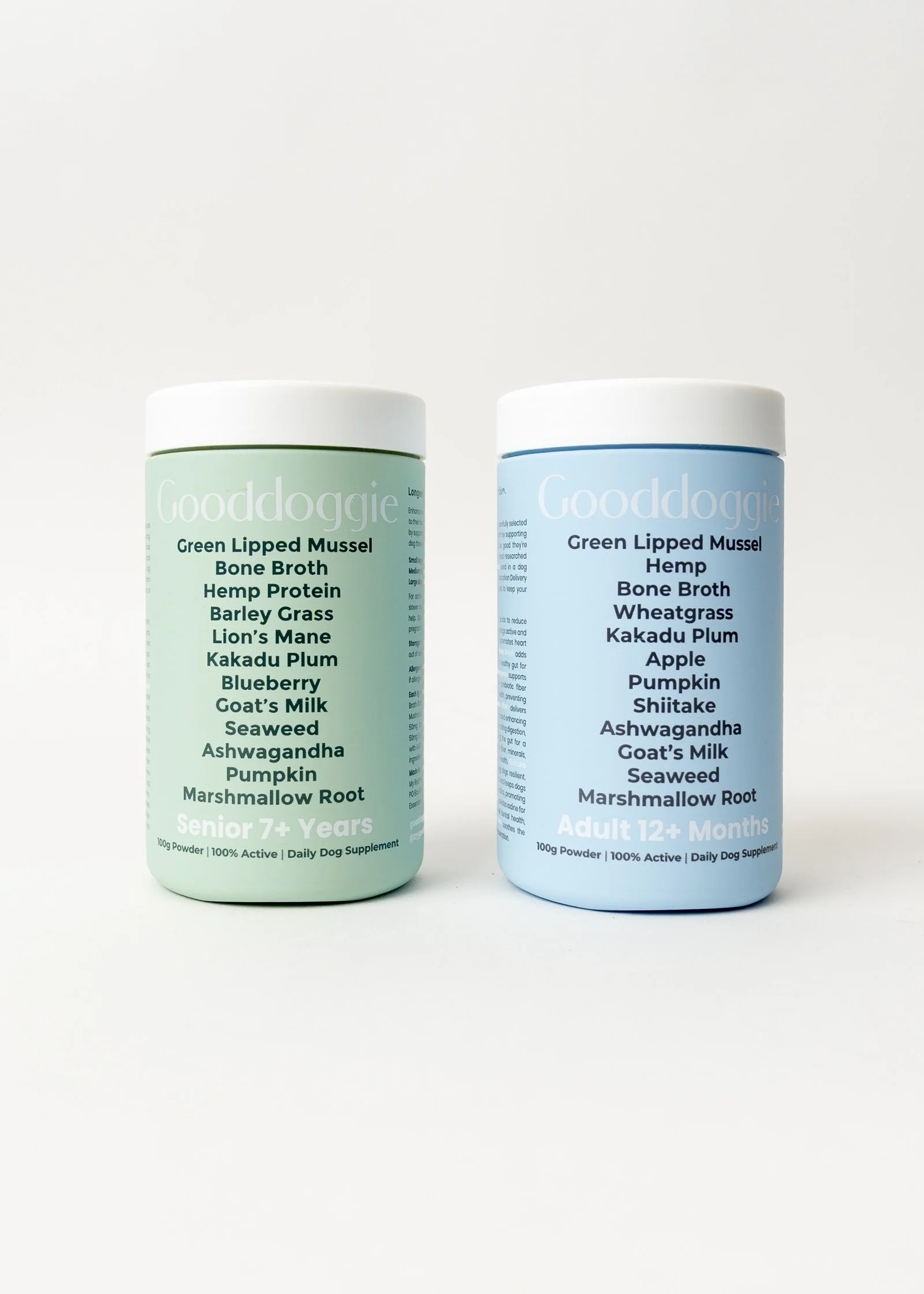 Two bottles of dog supplement powders, one labeled for senior dogs over 7 years old and the other for adult dogs over 12 months.