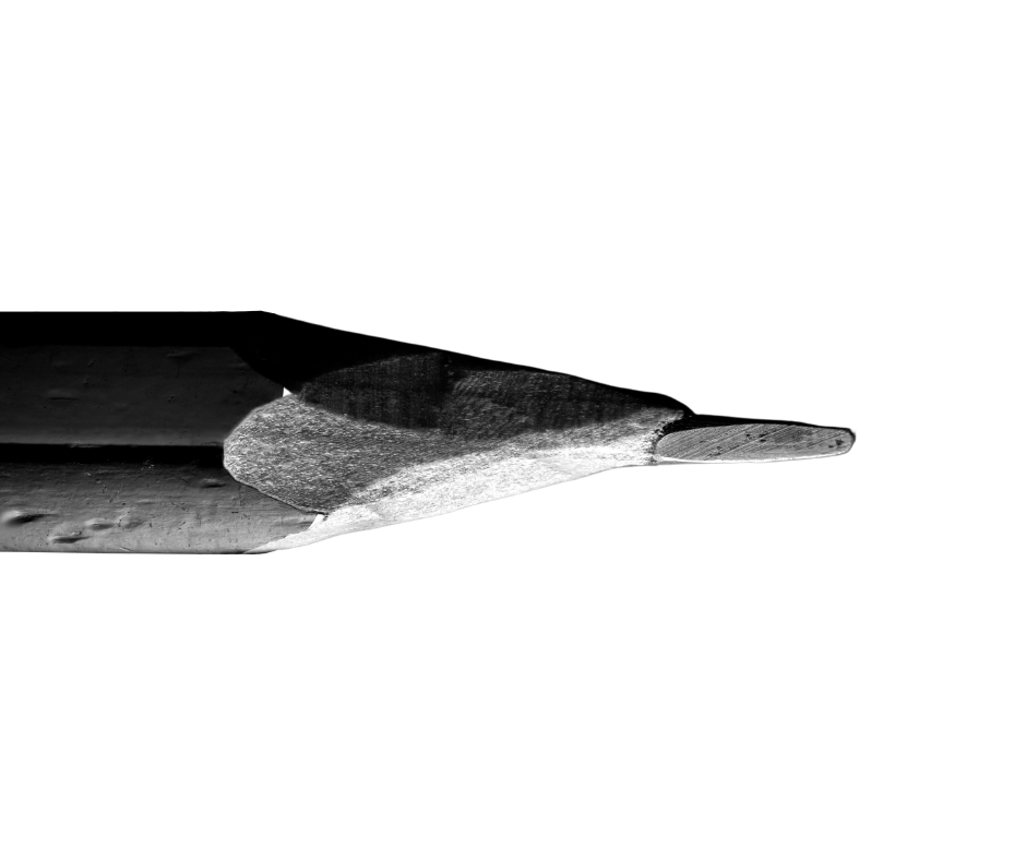 Black and white image of a small, flat object on a surface, with part of the image corrupted.