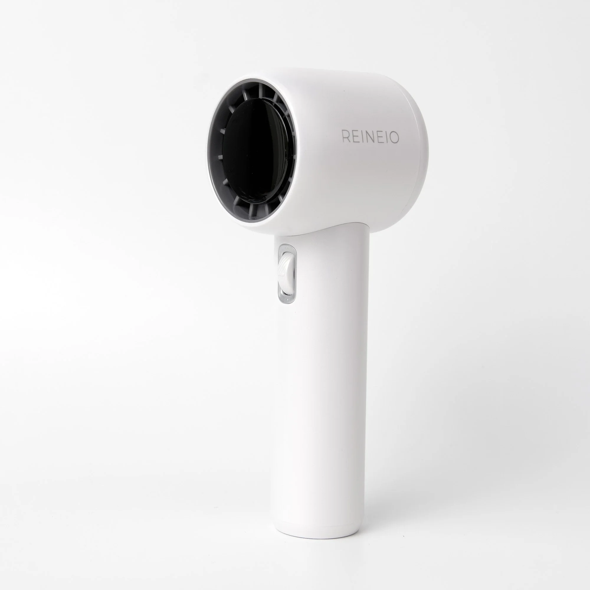 White handheld portable fan with arm and black vent, labeled REINEIO, against a plain white background.